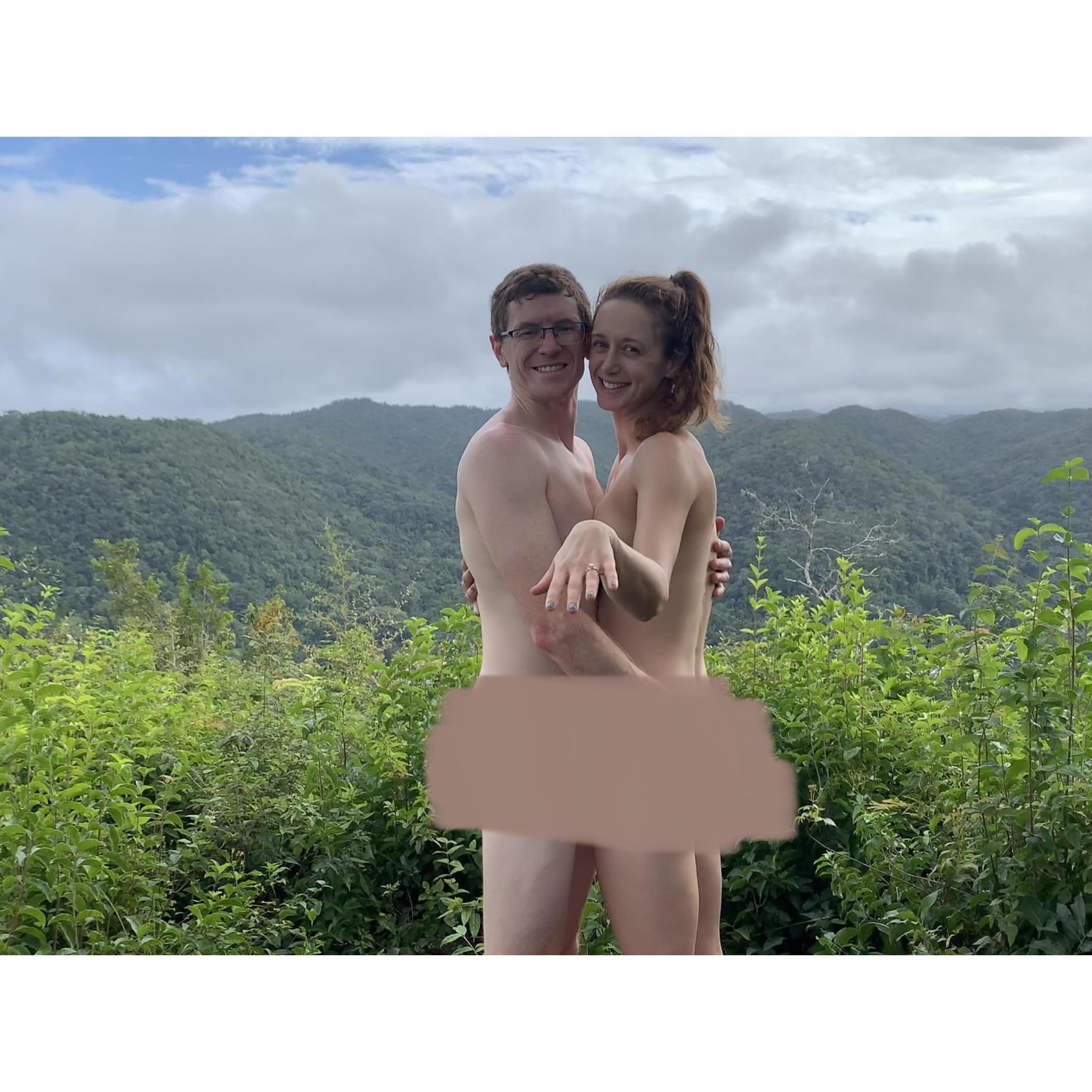 Belize. Jackie insisted on a naked photo on a mountaintop. Still nude, Joe got down on one knee & proposed. Jackie said yes. Then we had a nude engagement photoshoot courtesy of our selfie stick.