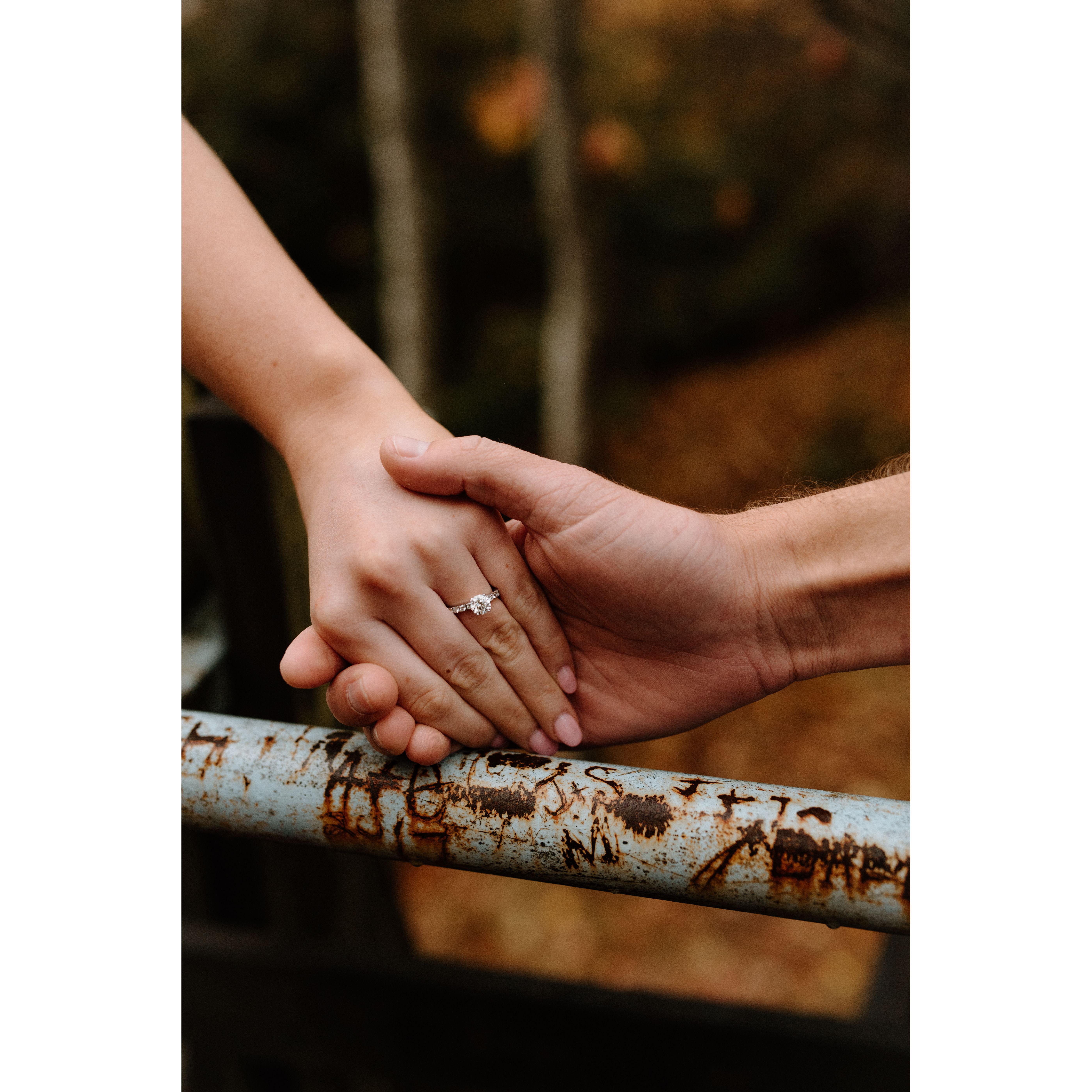 If you look close enough to the railing, you can see a J+S. Freshman year of college (2018) we came to this spot and carved that into the railing. 4 years later and we found it during engagement pics!