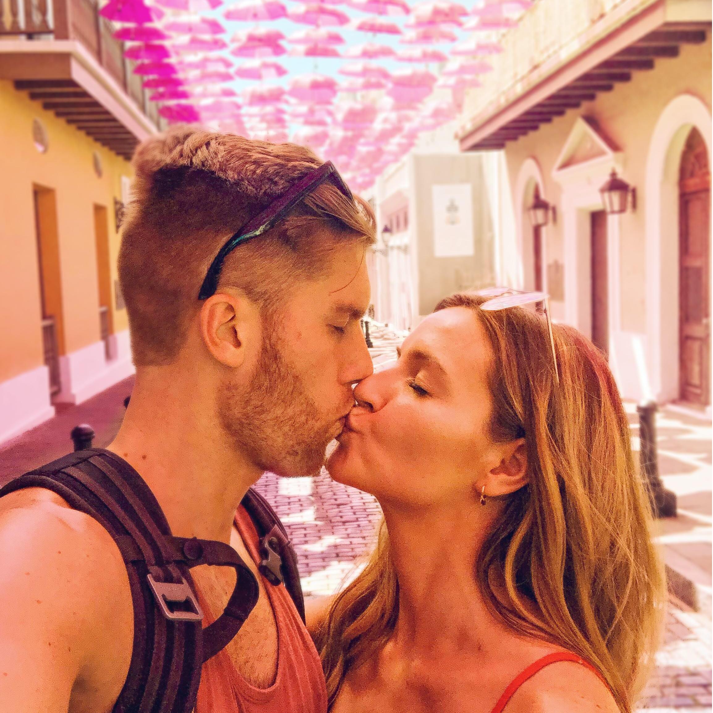 Standing under the umbrella (ella, ellas) in San Juan, PR