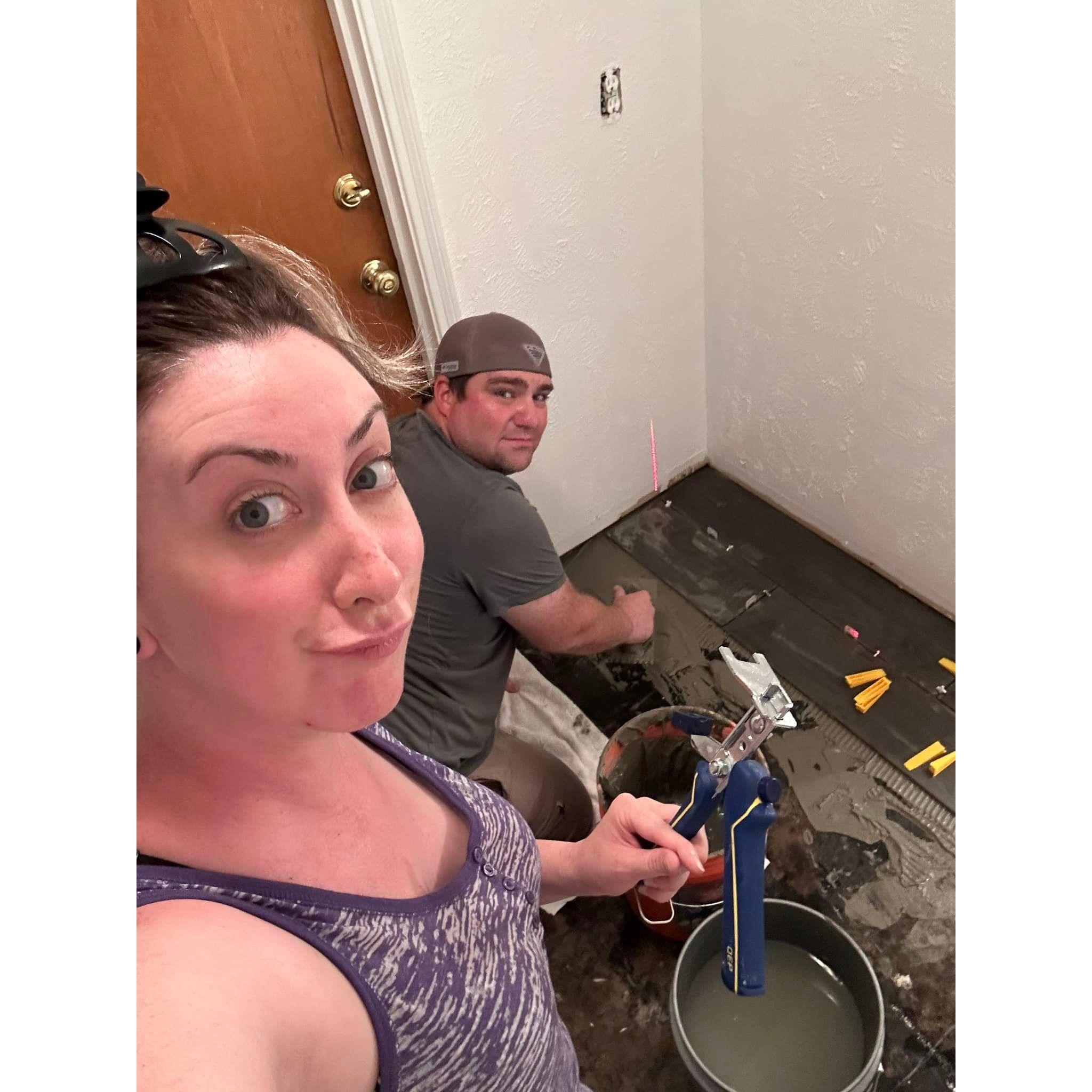 The remodeling projects seem to be never-ending on Kathryn's, now also Aaron's, old house! They both learned how to lay tile together in the summer of 2023. Aaron's face speaks for itself!!