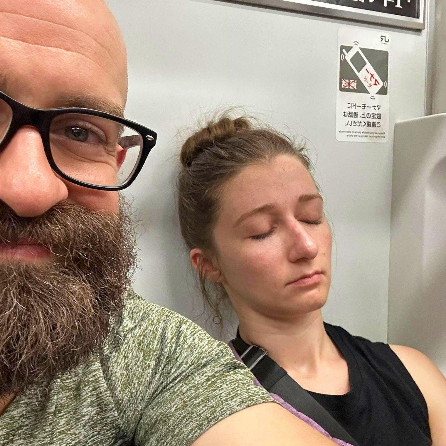Abbie showing off her top-notch power-napping skills, Justin finding this amusing