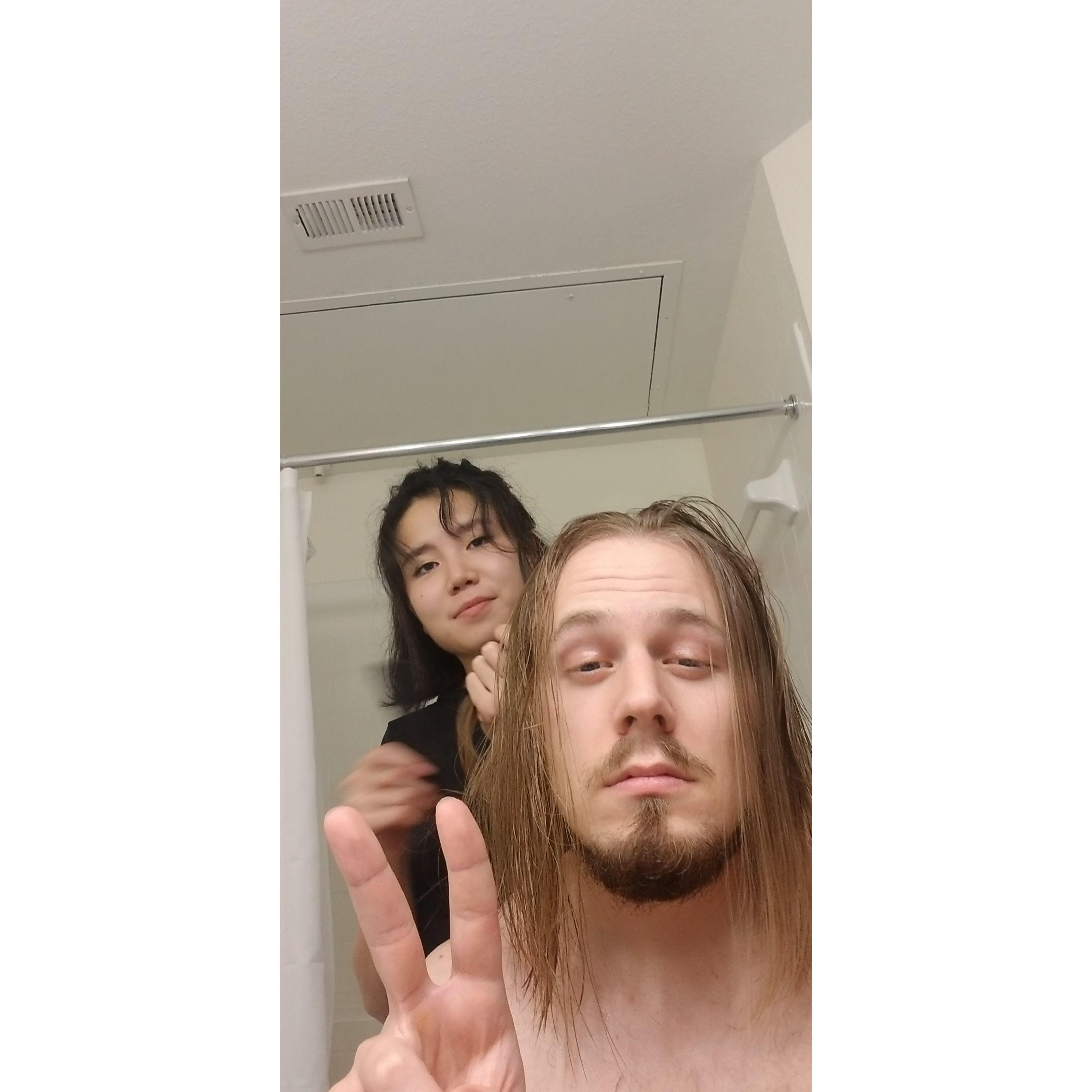 Namuuna trimming Michael's hair [May 2021]
