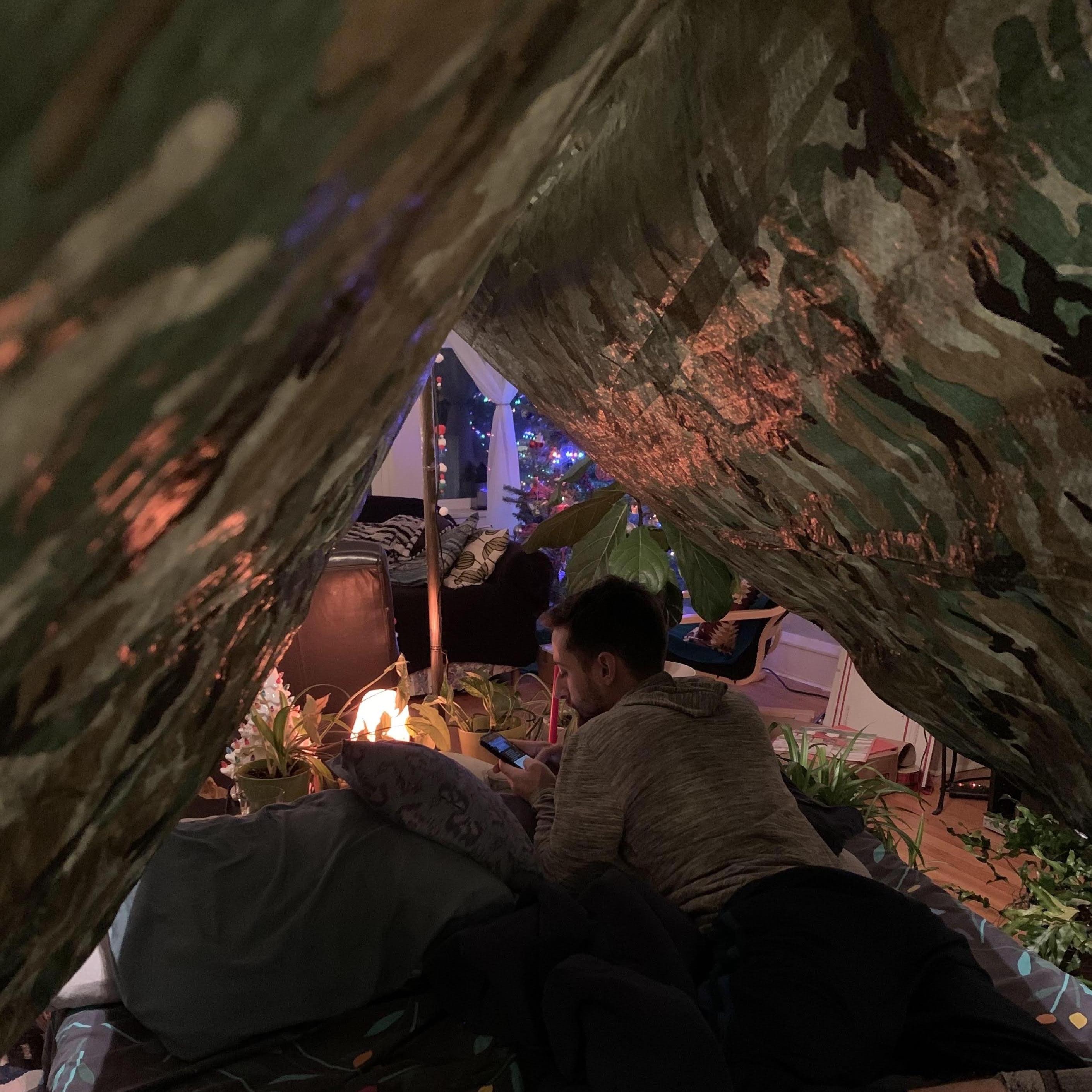 Alex set up an indoor campsite for Mayo's birthday in 2020, complete with fresh caught salmon, worms, dirt and smores.