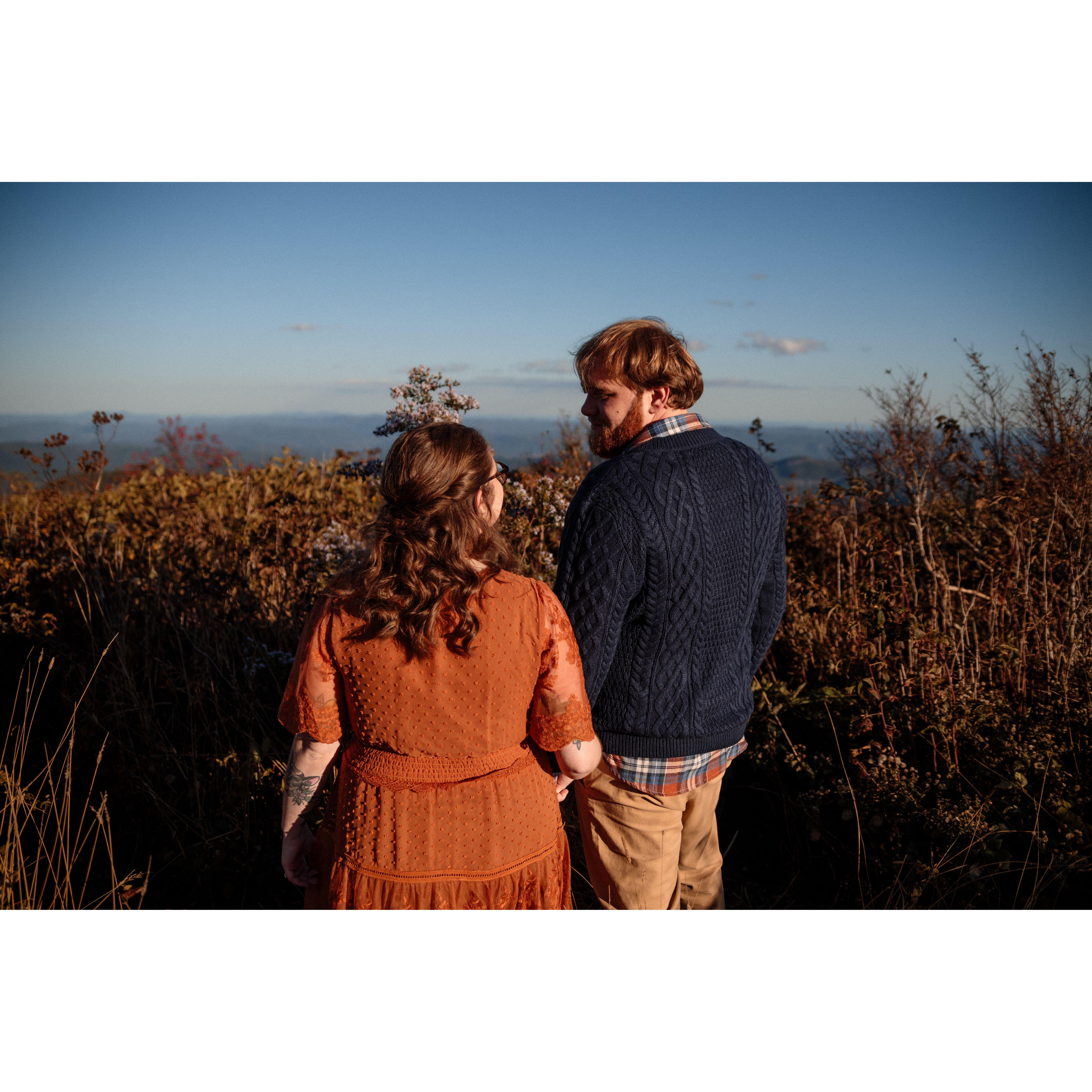 Gazing into each other's eyes in front of the gorgeous North Carolina mountains.

Taken by Simon Bonneau of Grand Jour Photography