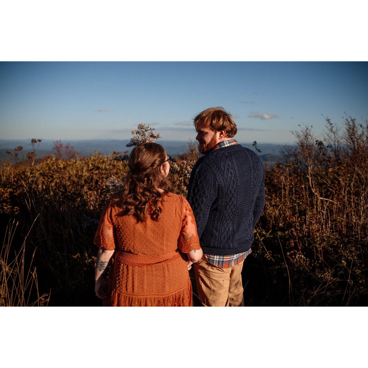 Gazing into each other's eyes in front of the gorgeous North Carolina mountains.
Taken by Simon Bonneau of Grand Jour Photography