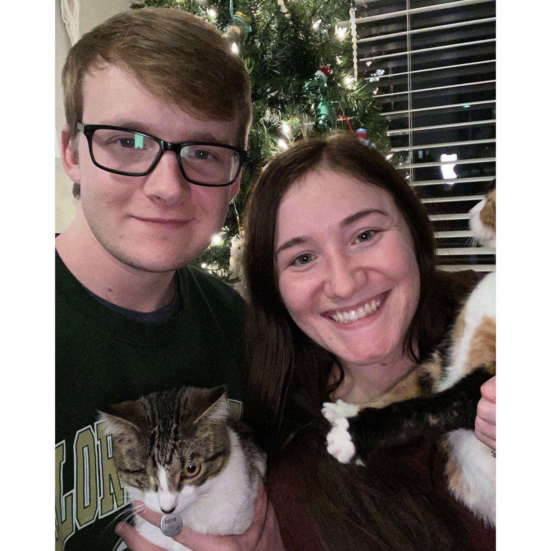 Family photo, our 1st Christmas with Sophie the one eyed demon cat