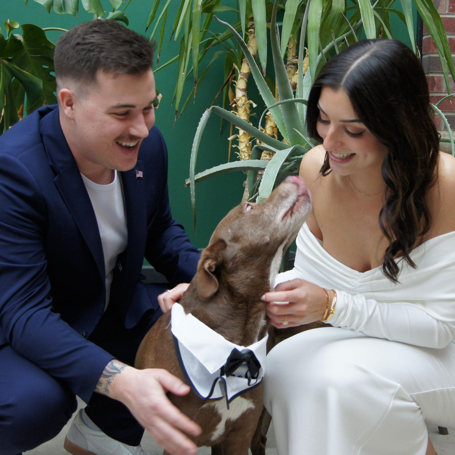 Couldn't have our special day without our dog, Tucker. If you know him, you know he loves to give kisses!!
