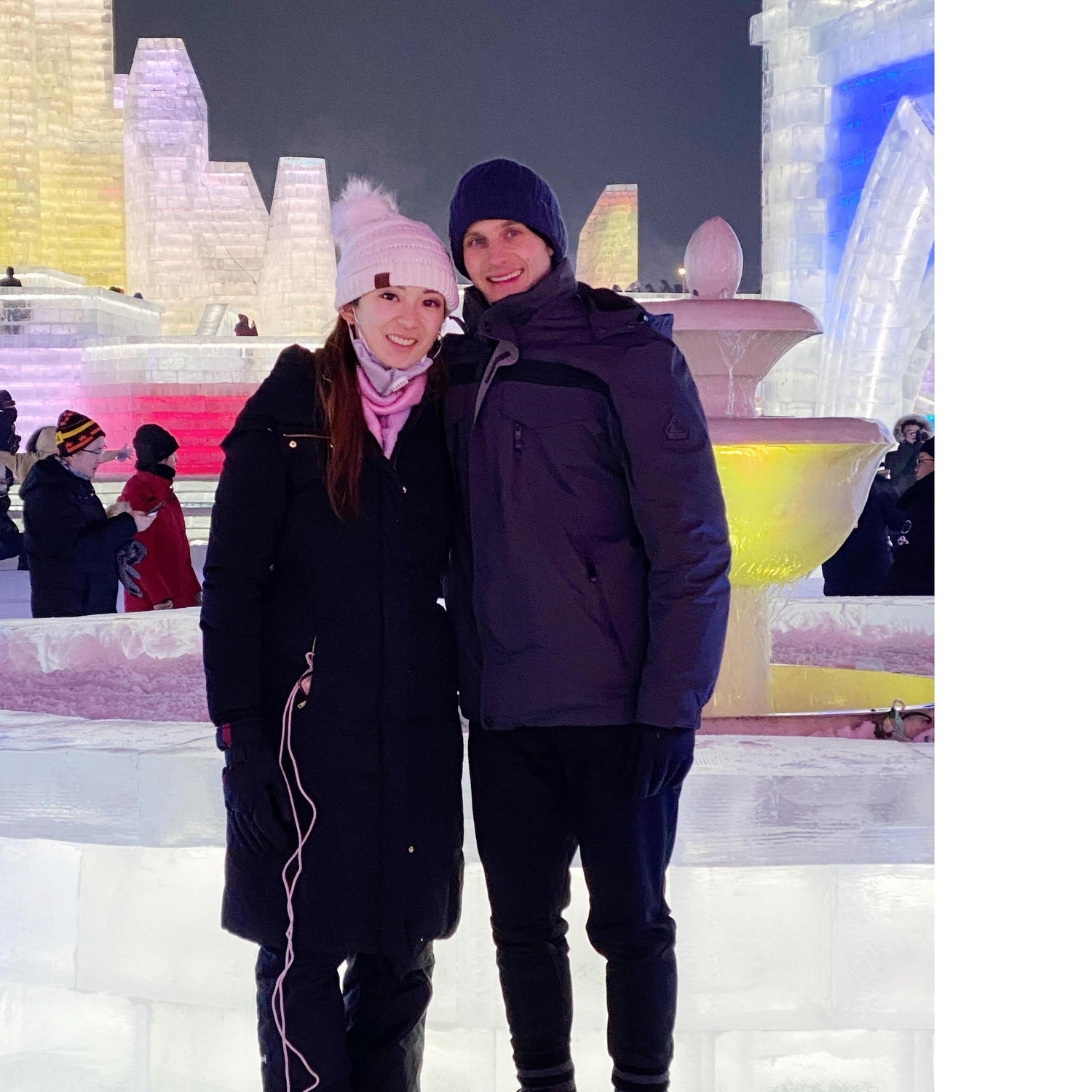 In Harbin in front of the beautiful man-made ice castles and snow sculptures.