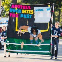 Fall 2014 - a couple of months after Dan asked Haley to be his girlfriend, he helped her carry the freshman banner in the Homecoming Parade.