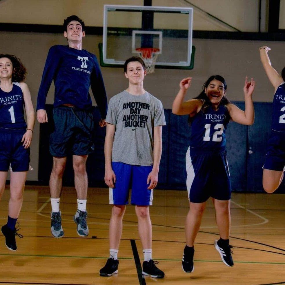 2018: This shot of Addie and Peter with Trinity Thunder bball classmates highlights Peter’s resident Tall Guy status and Addie’s subpar jumping ability. And Peter’s apparent resistance to uniforms?