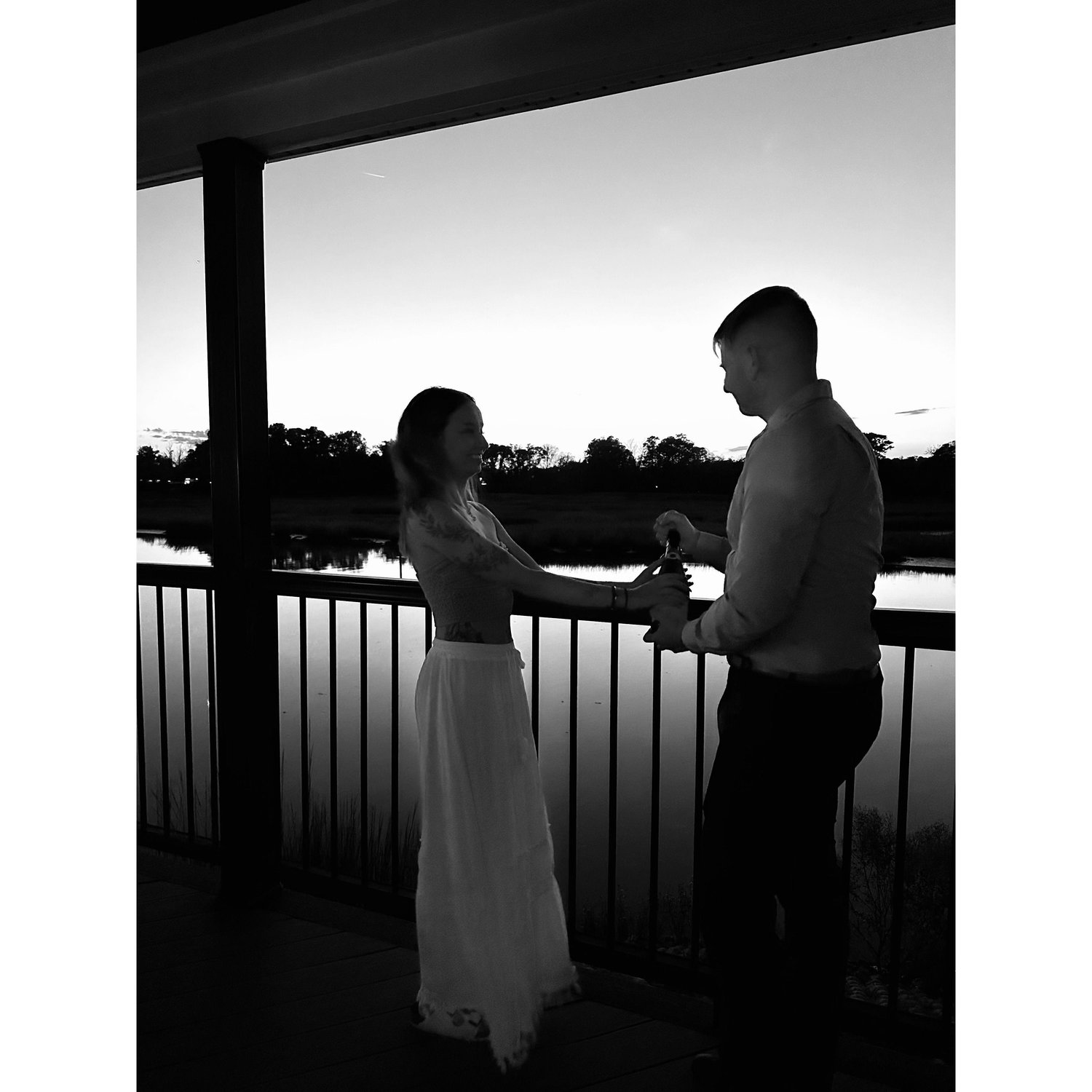 Popping a bootle of champagne to celebrate our engagement night woot woot !