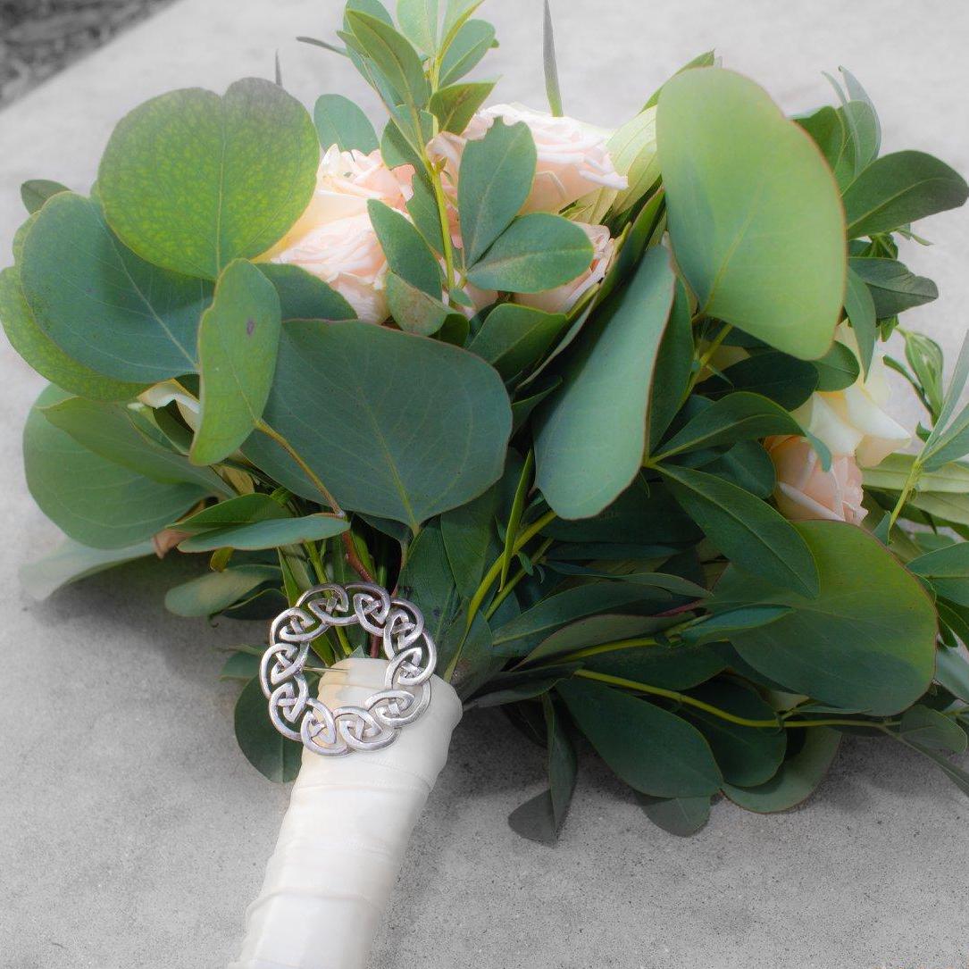 The bridal bouquet with Sarah's grandmother's brooch