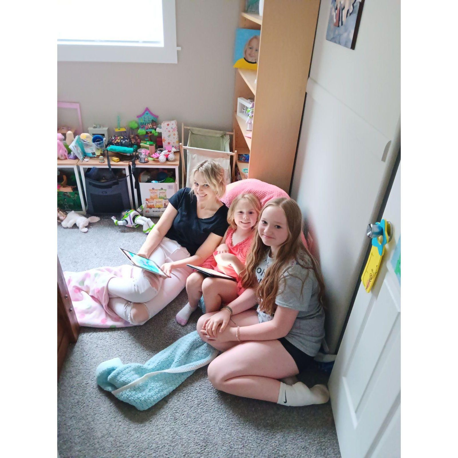 Abby and Emily are teaching me different games on the ipad.  This is when the power was out due to a small tornado that came through that day.