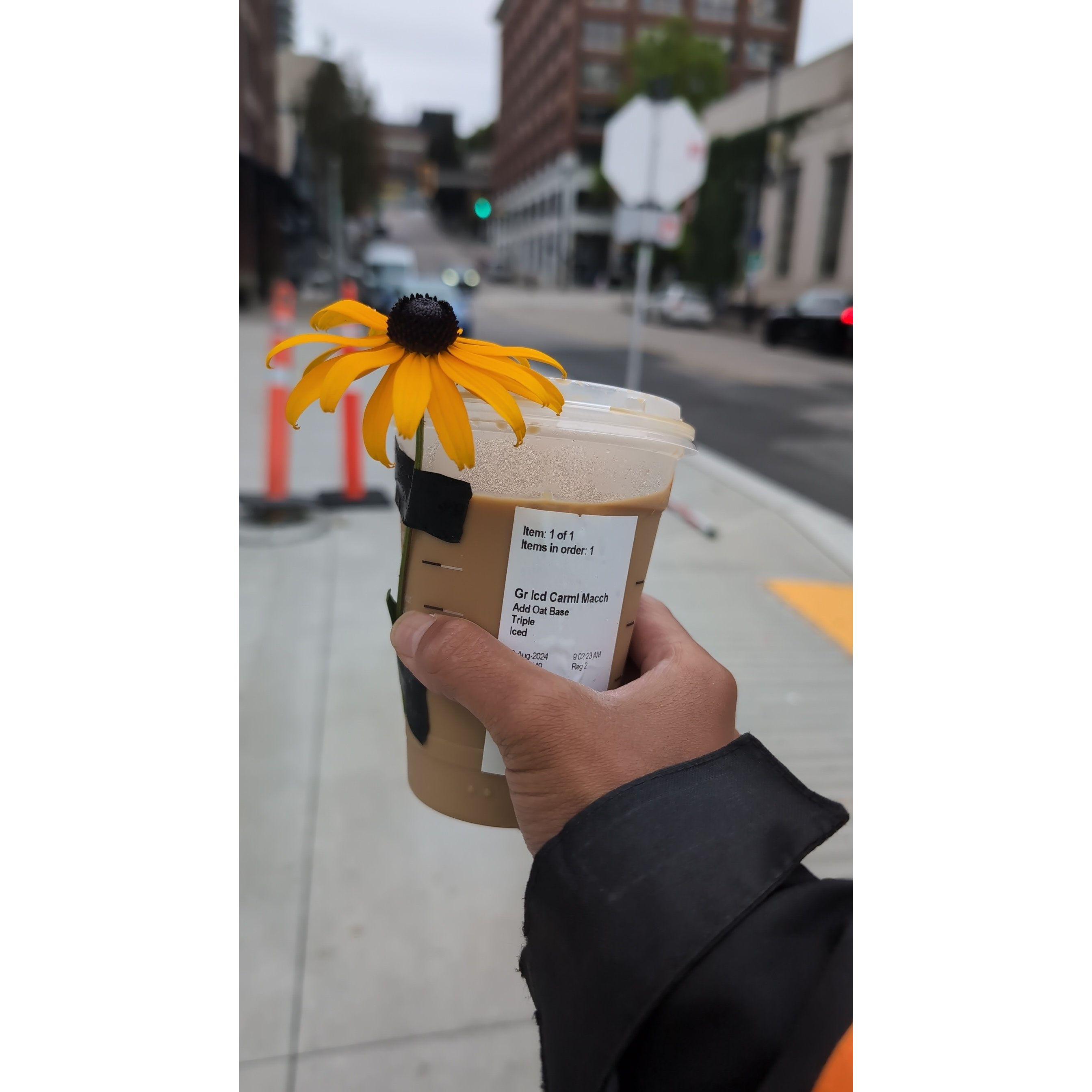 The first cup of coffee Christian got Daenna. He went around looking for a flower of her favorite color and taped it on a caramel macchiato.