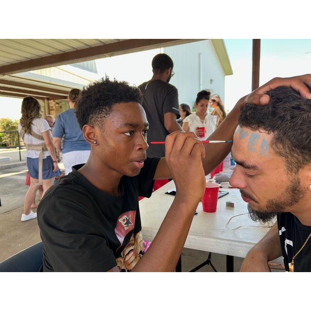 Tahj painting "Lover Boy" on Jayvon