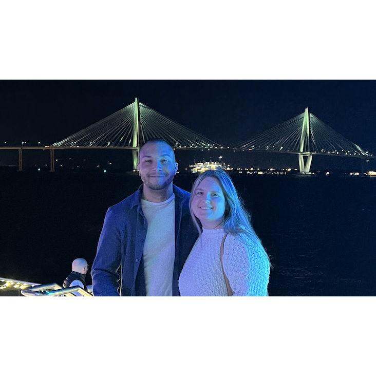 A magical night in Charleston, with the Ravenel Bridge shining bright in the background.