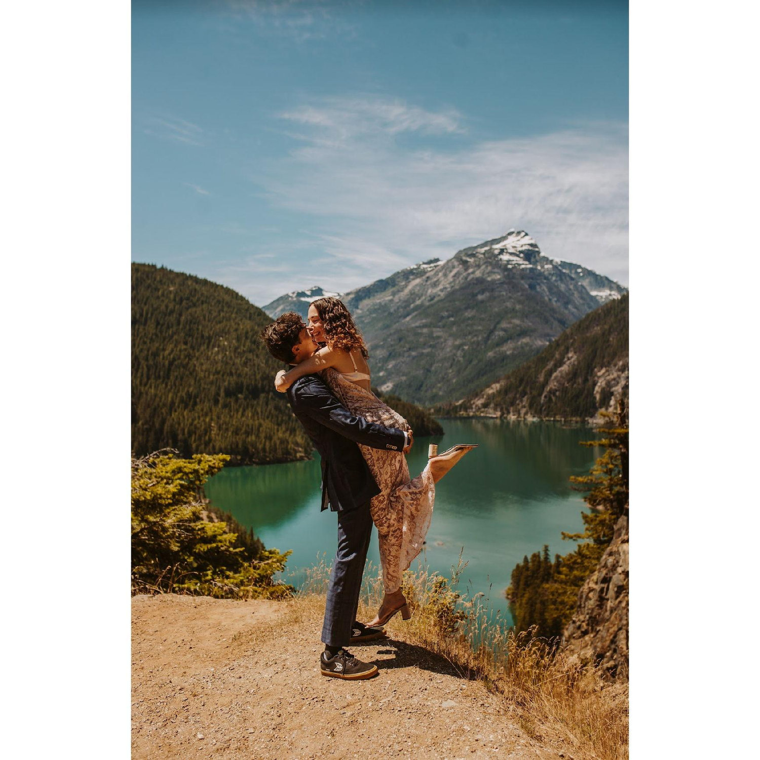 From personal experience, we can now recommend jumping into your partner's arms at gorgeous lakes for photo shoots. This was taken at one of our favorite trips ever.