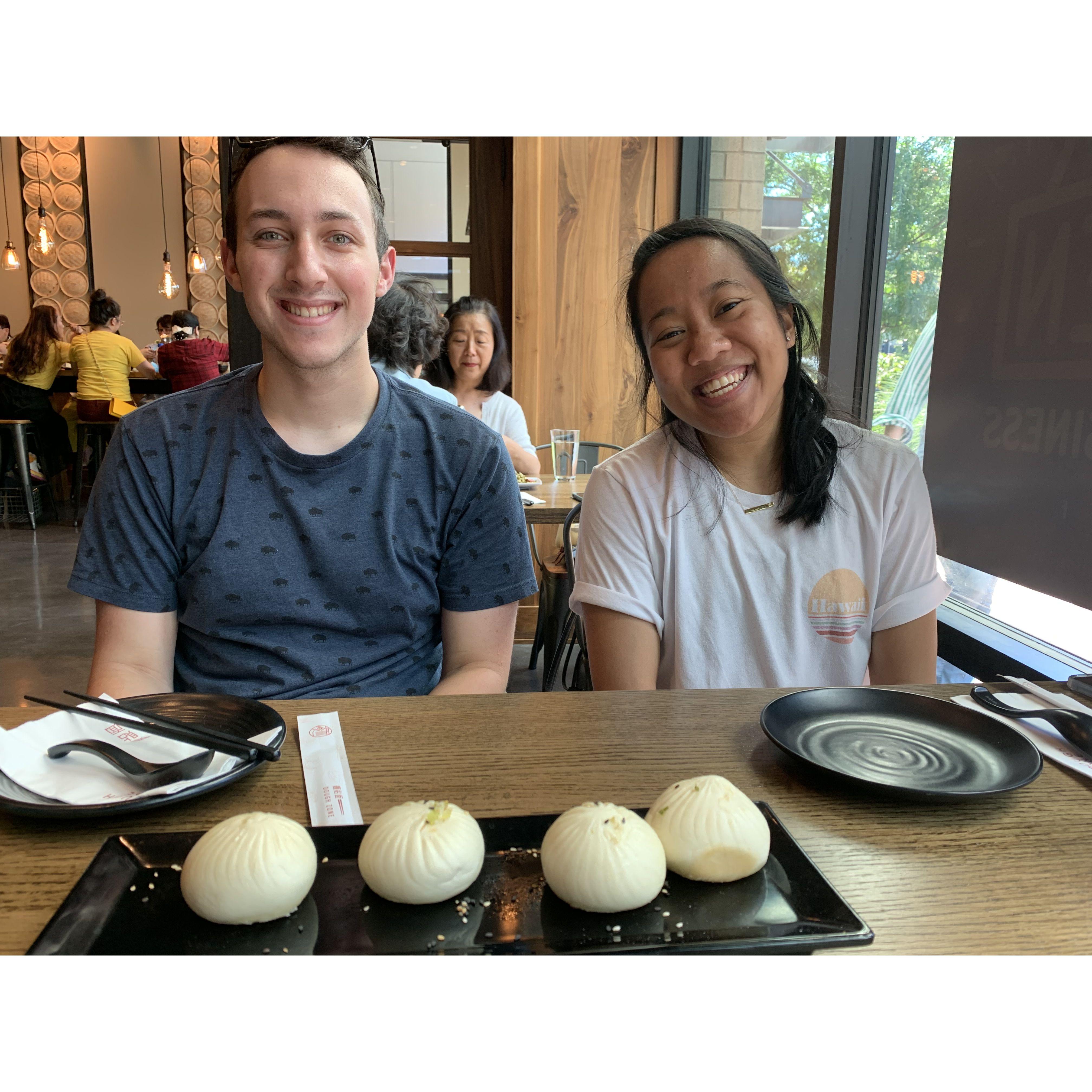 We met in late 2020 while we both worked at the Container Store in Bellevue, WA. 

*Photo of us at our local Dough Zone* 06-27-21