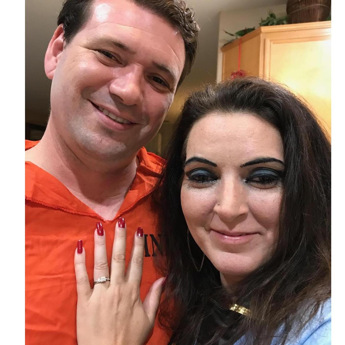 Lance surprised Cheri on Halloween night with "Cheri, Will You Marry Me?" carved into pumpkins. Dressed as a cop and prisoner. Crime: stealing her heart. Sentence: his heart for life.