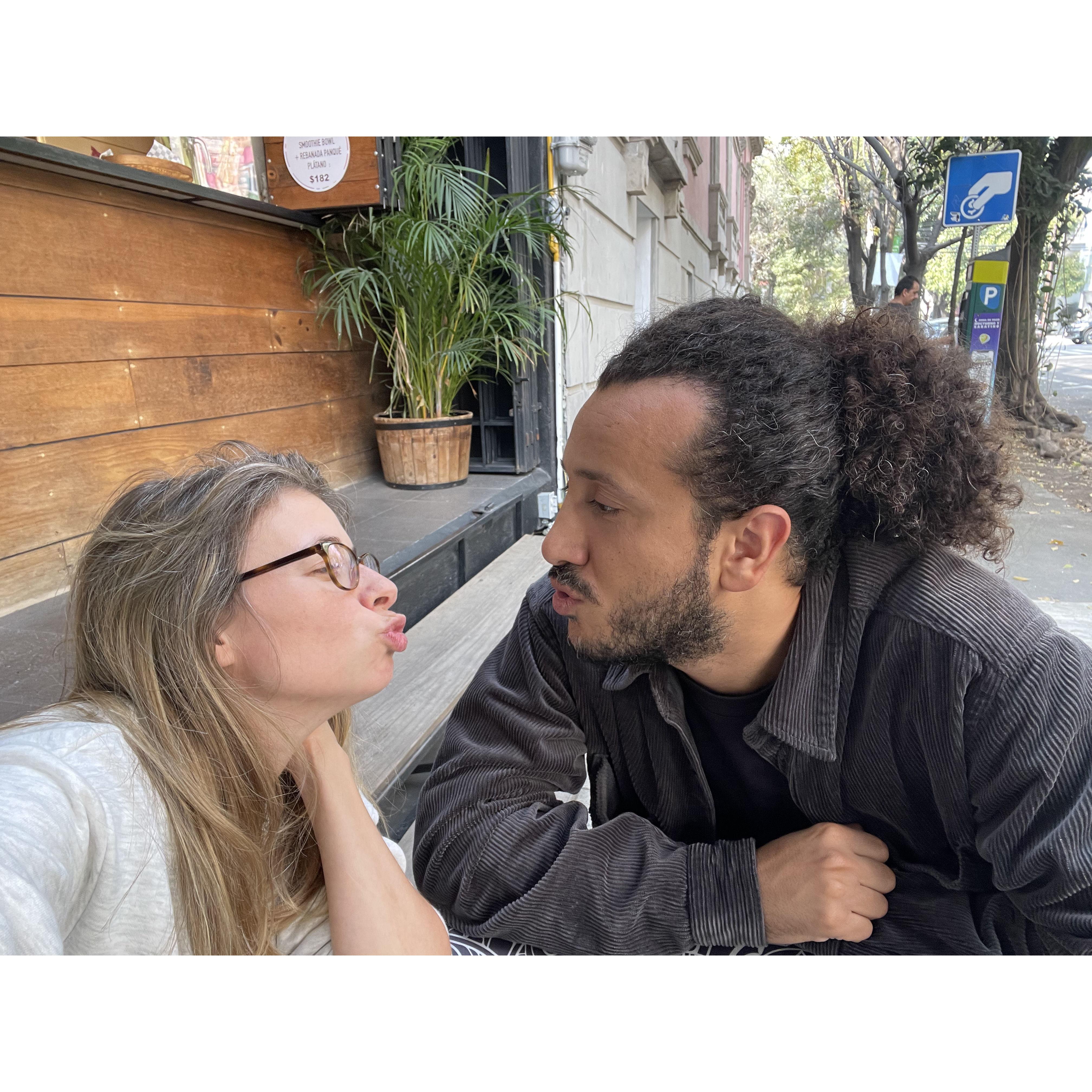 A little kiss at a cafe in Mexico City