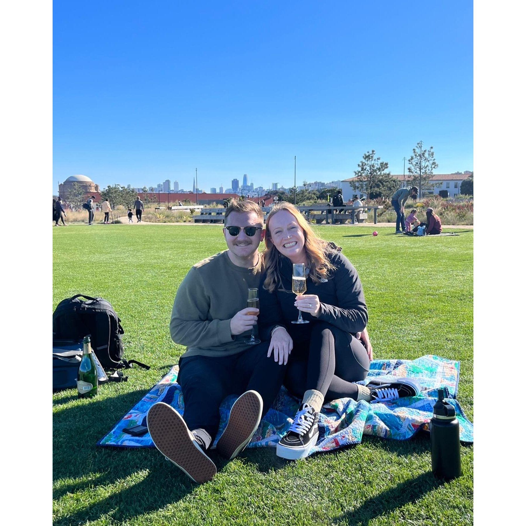 Strangers walking by witnessed the proposal and took our first photos as an engaged couple.