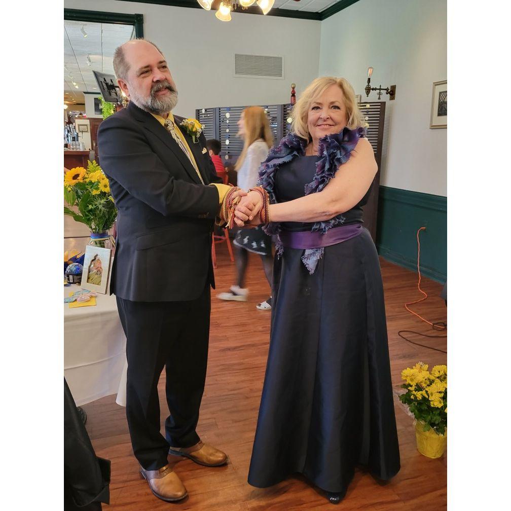 Hand blessing tied by Stephen and Grace.