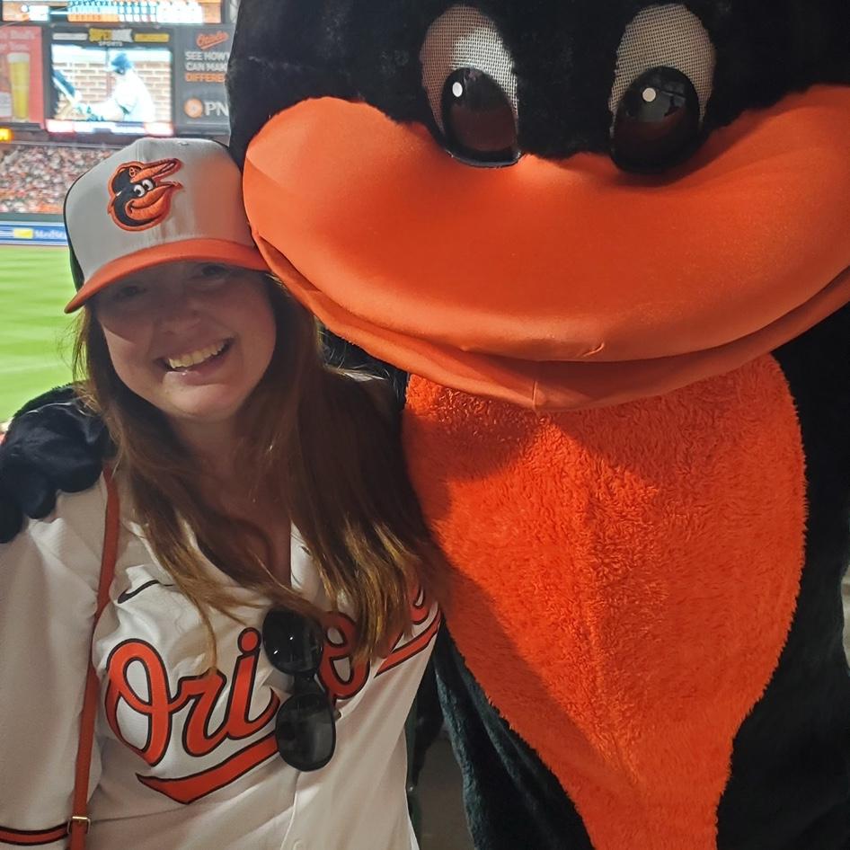 At Greg's urging, one of the few times Kristen has gotten over her fear of mascots.