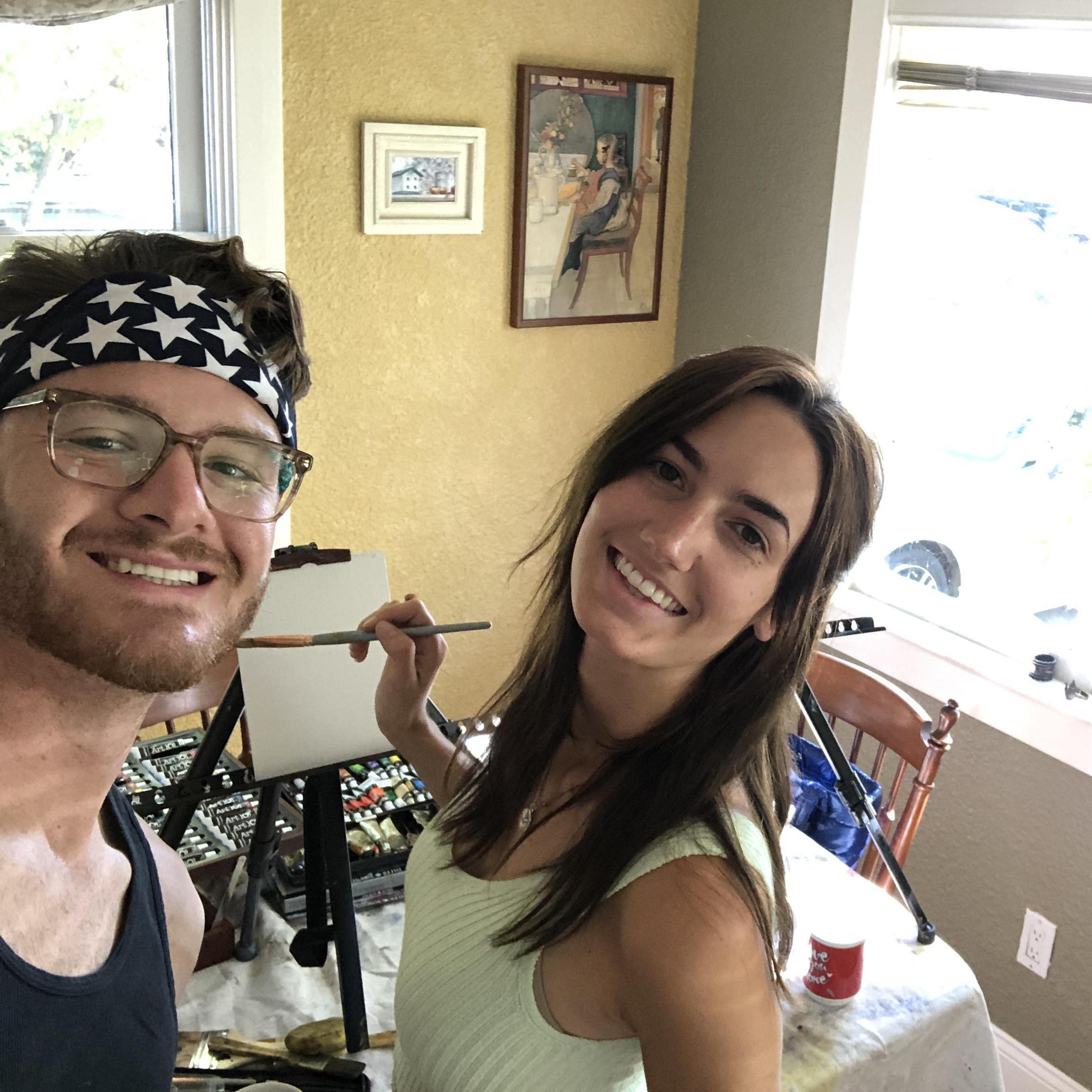 We bought painting supplies and learned how to (try to) paint like Bob Ross. This was taken before we got messy