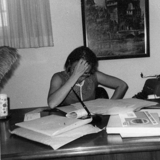 Now Elaine is up at Carol's desk..