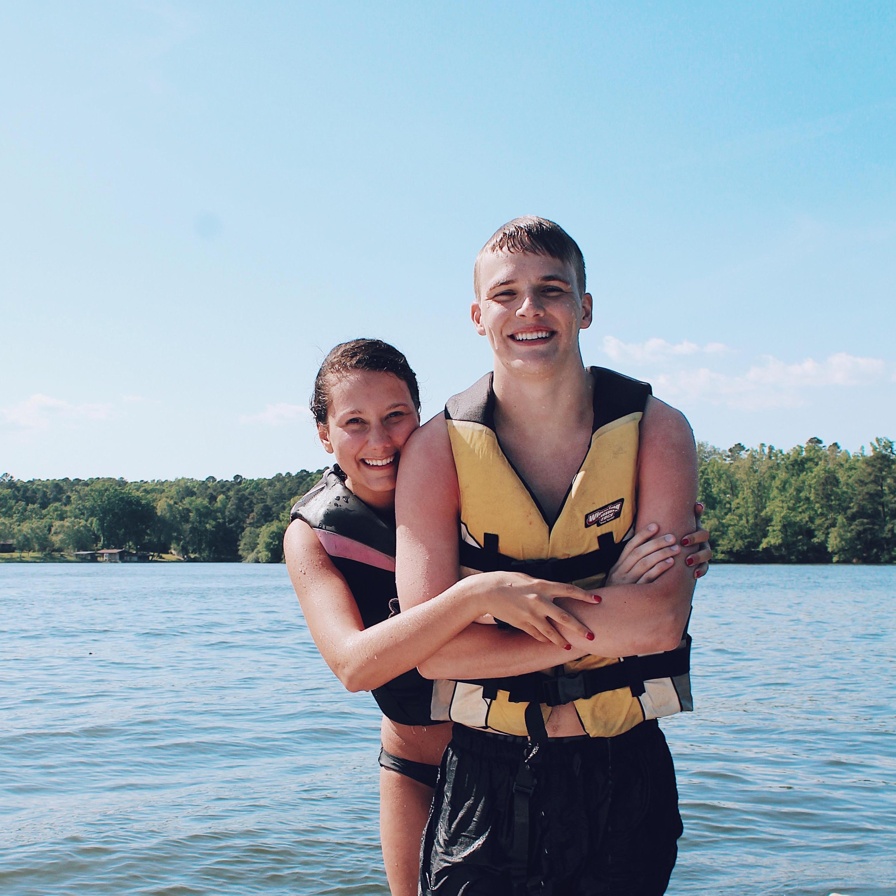 Hannah teaching Nathan how to lake surf