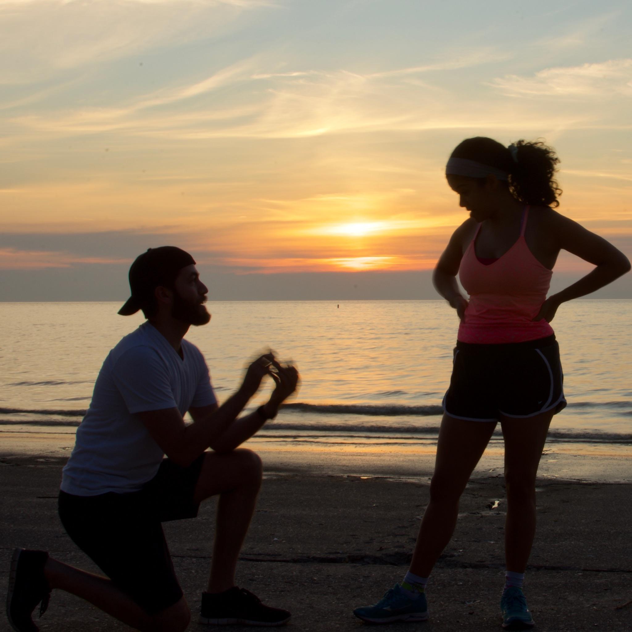The proposal right as the sun was rising at Oak Street Beach along Lake Shore Drive on July 4th, 2020. Alex clearly did a great job setting up the surprise.