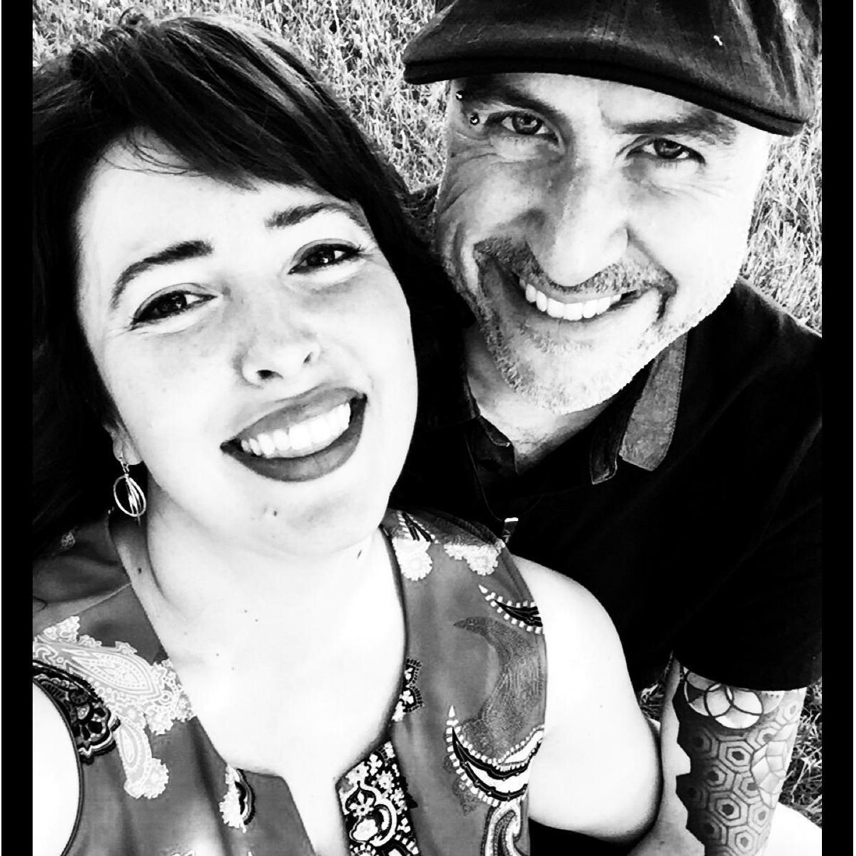 Stealing away to get schmoopy at Travis' cousin's wedding last year.