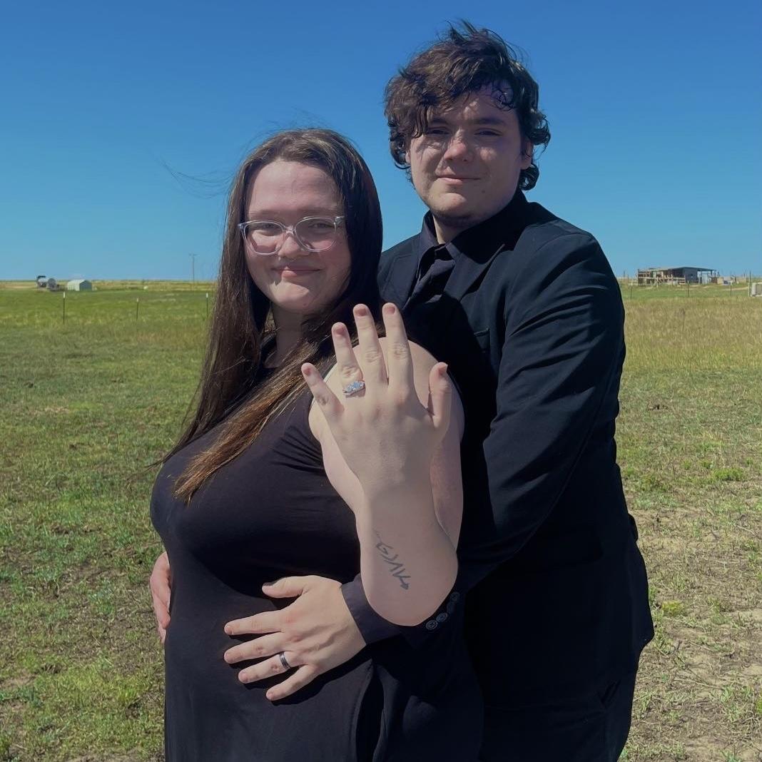 One of our engagement photos we were both tired and it was hot this day!!
