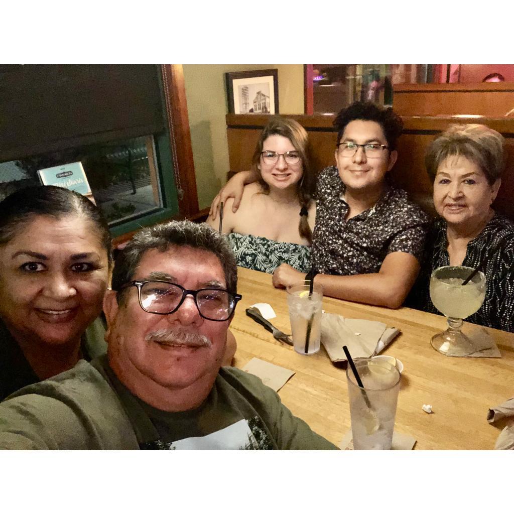Enjoying dinner with Manny's family