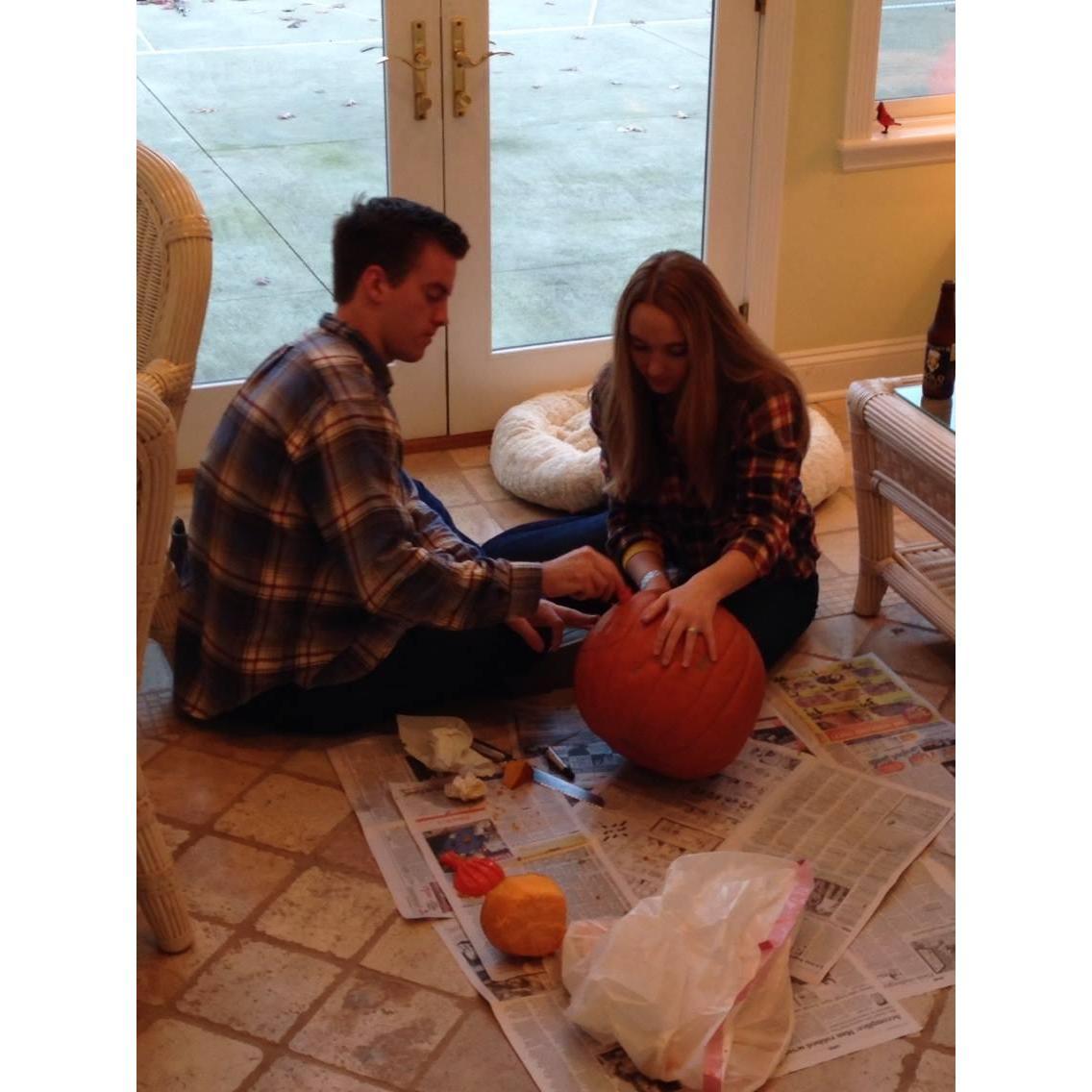 Pumpkin carving at the Barnic's! this tradition lasted a total of 1 year.. Chris isn't a pumpkin carving fan lol