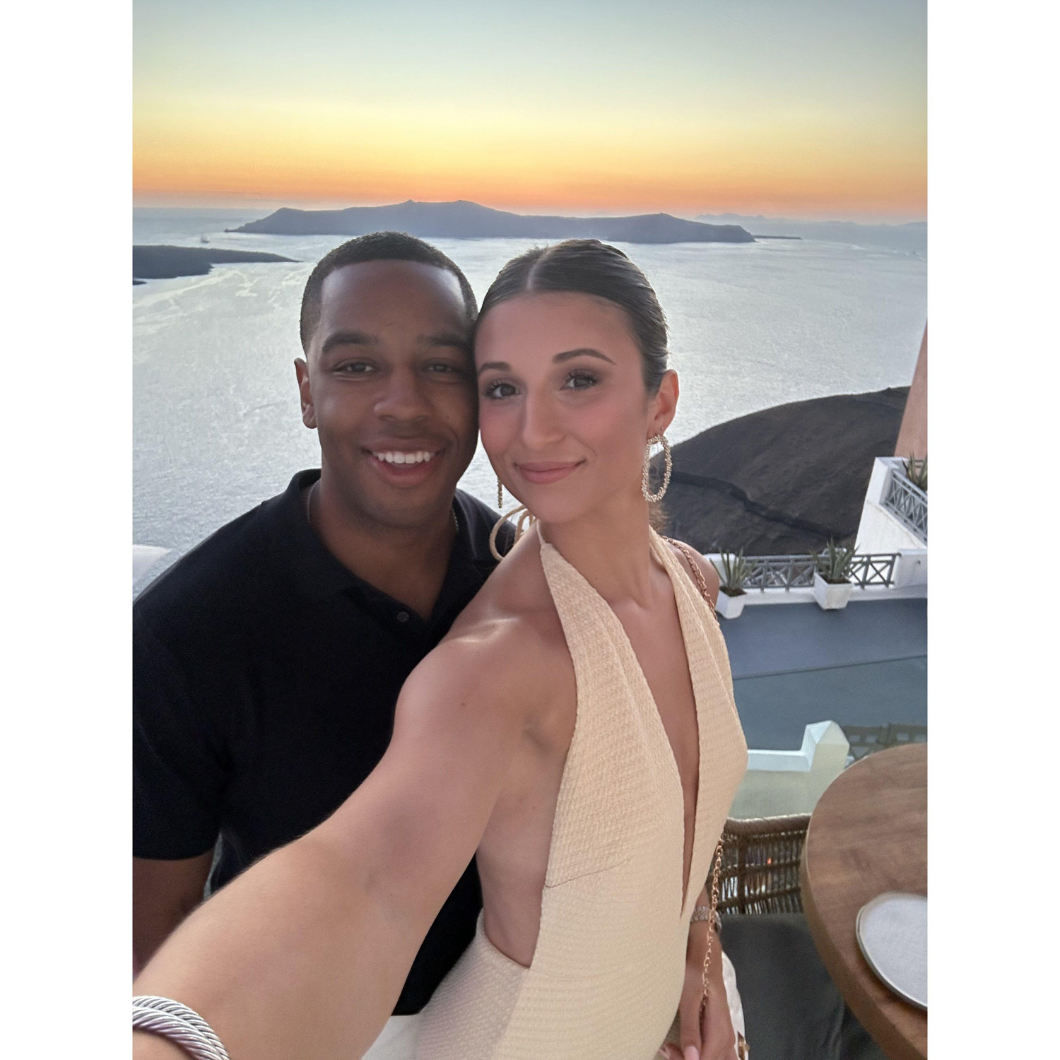 Enjoying the Santorini views while celebrating our best friend's wedding
