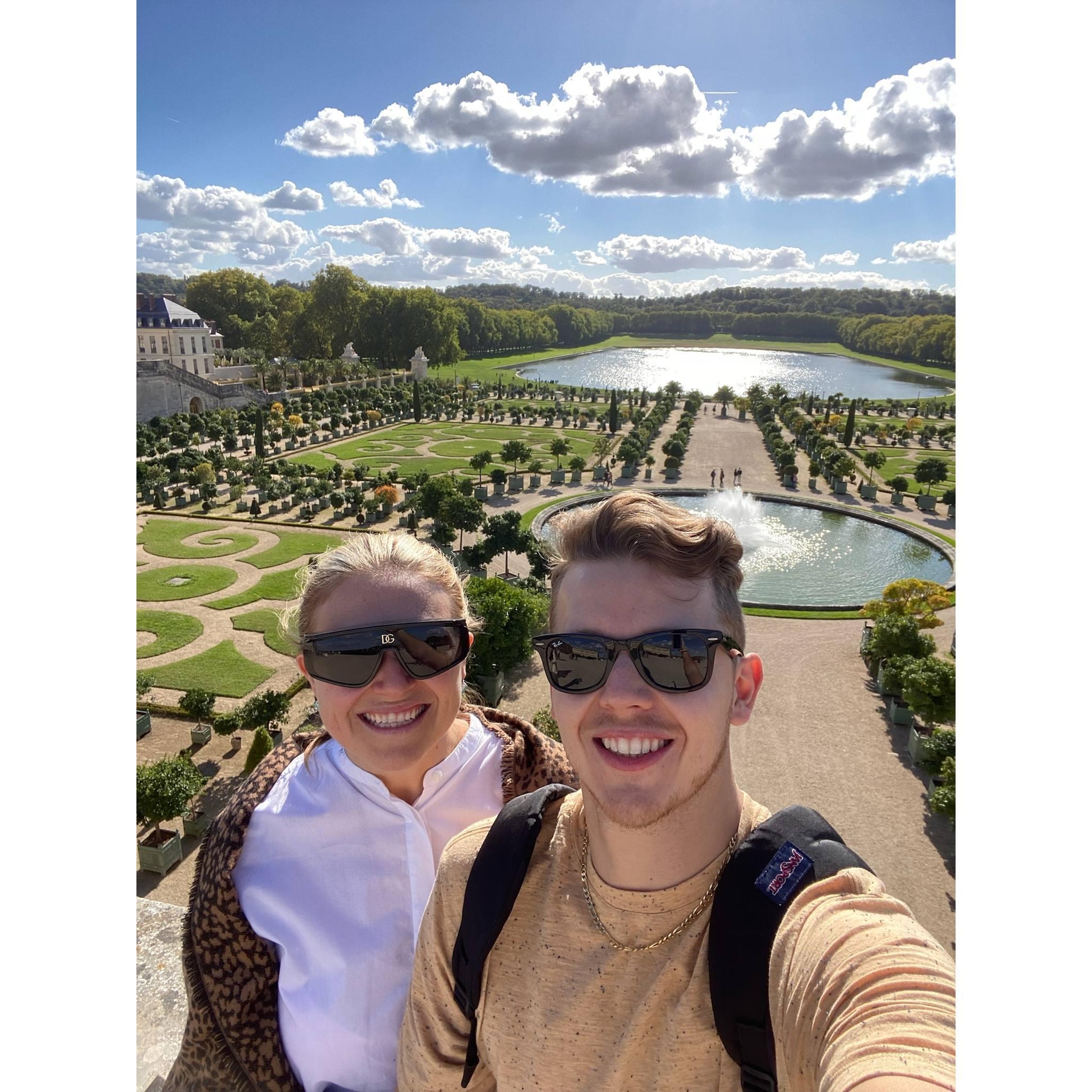 Visiting the Palace of Versailles.