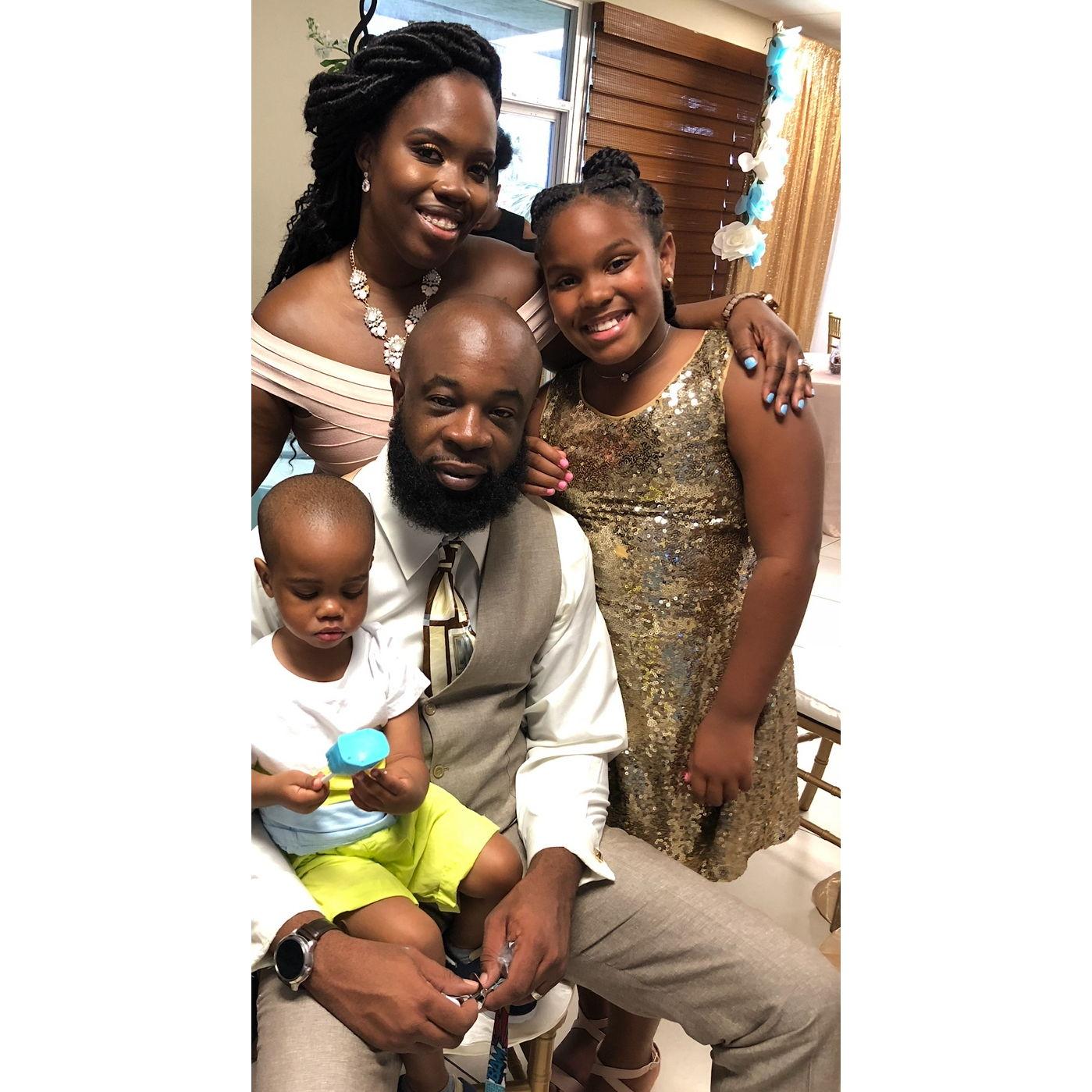 Family photo of us at our sisters wedding.  Tahj wasn't interested in photos then and still until this day.
