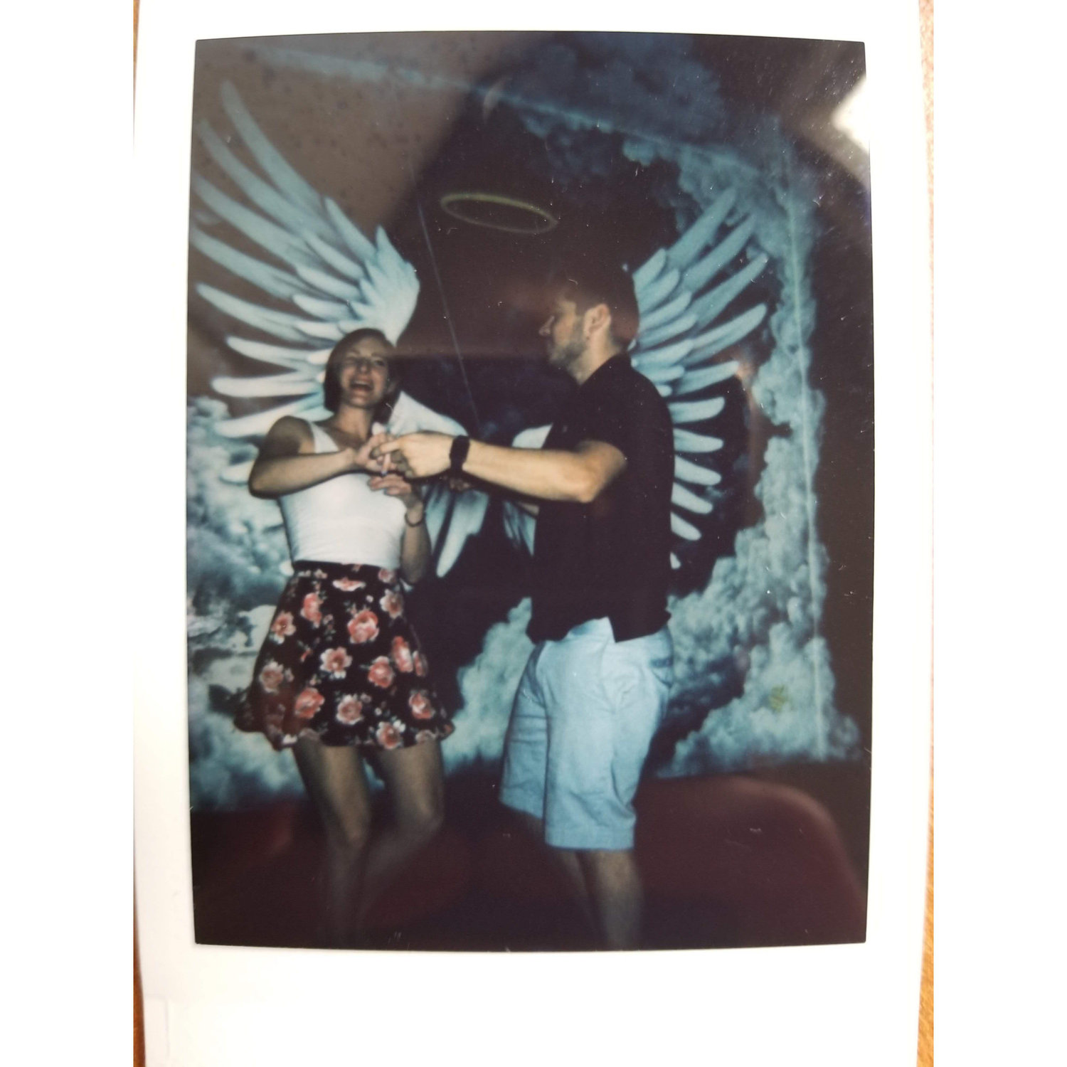 Our fist photo together. A polaroid taken by a complete stranger at Power and Light in downtown Kansas City right after we met, 2018