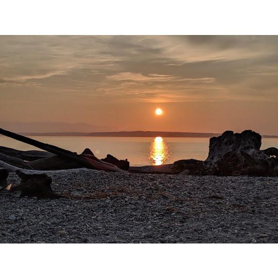 a very special photo, this is the first sunset we watched together as it set over the water at Carkeek park. on may 5th 2024, we proposed to each other in the very same spot! <3