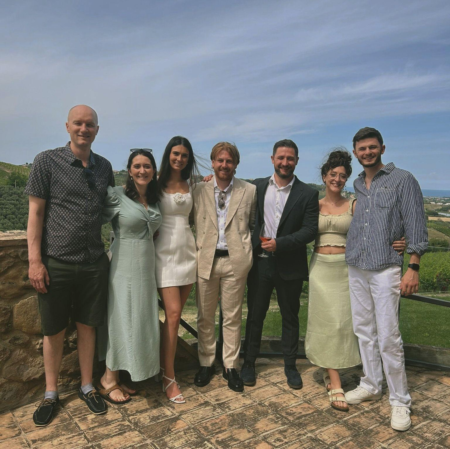 Family picture at Char & Jake’s wedding in Italy! All couples look charming, especially the two gentleman in the middle.