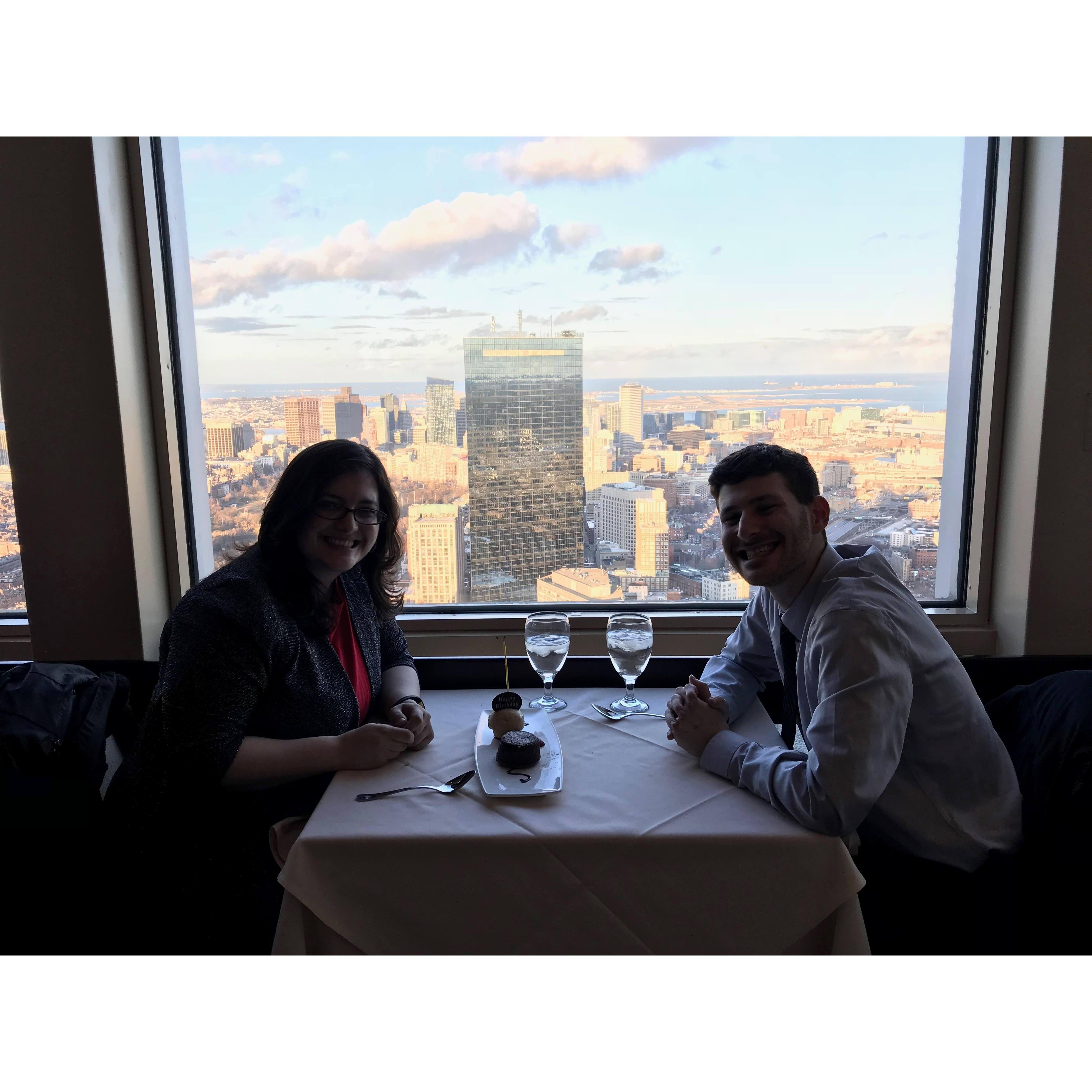 Birthday dinner at Top of the Hub in Boston, MA, on March 25, 2018, mere hours before he proposed. He had the ring in his pocket in this very picture! And I had no idea!