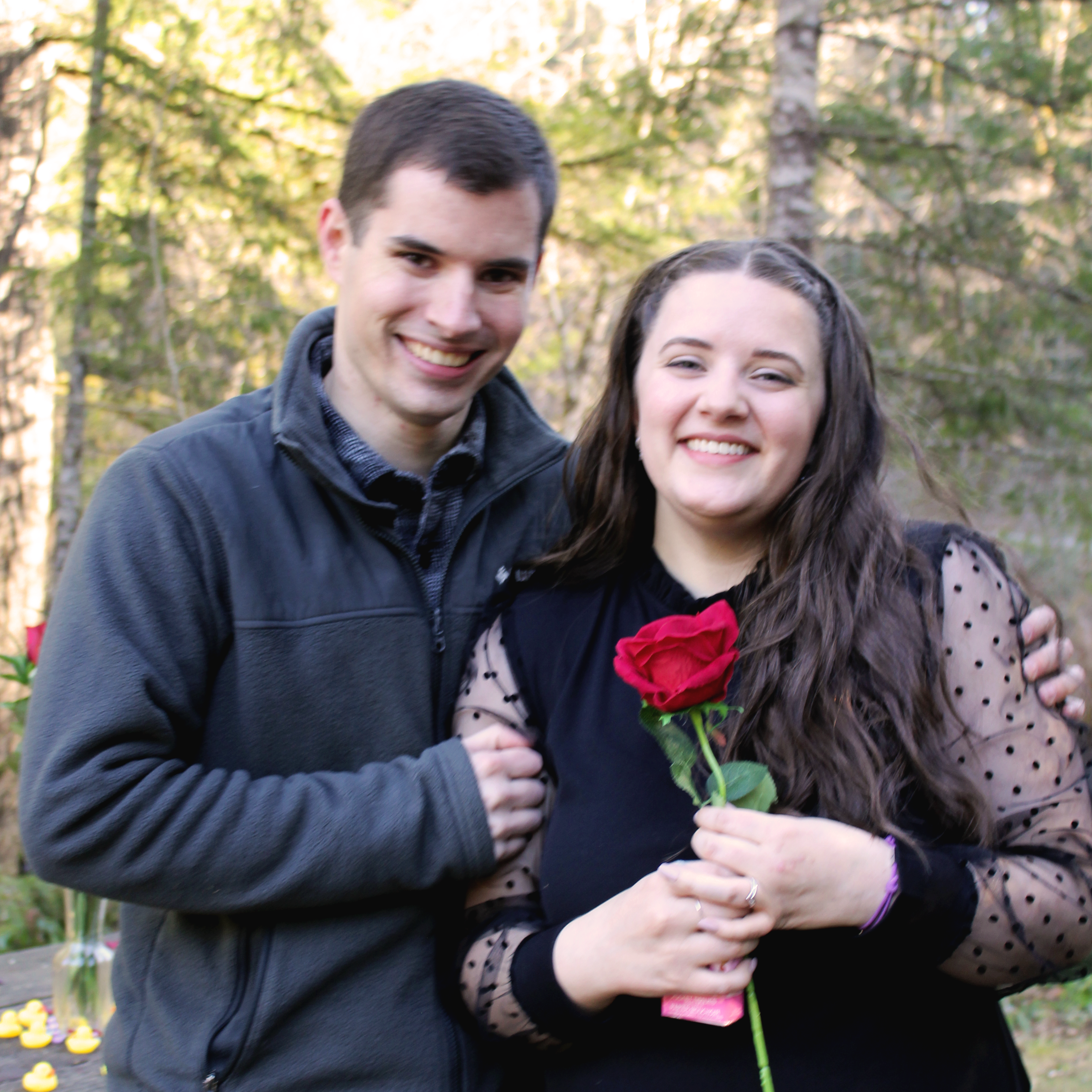 shhhhh..... nobody tell.... that rose is actually the ring box ;) And yes, Rebekah is holding a pack of tissues in preparation for the waterworks... Disney princess tissues :)