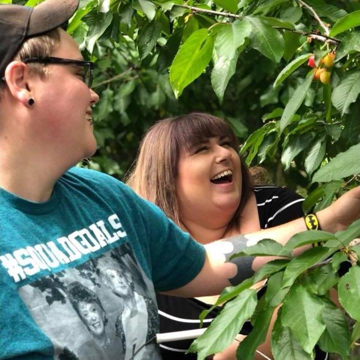 Someone snapped this picture of us cherry picking on our first family outing as a couple!