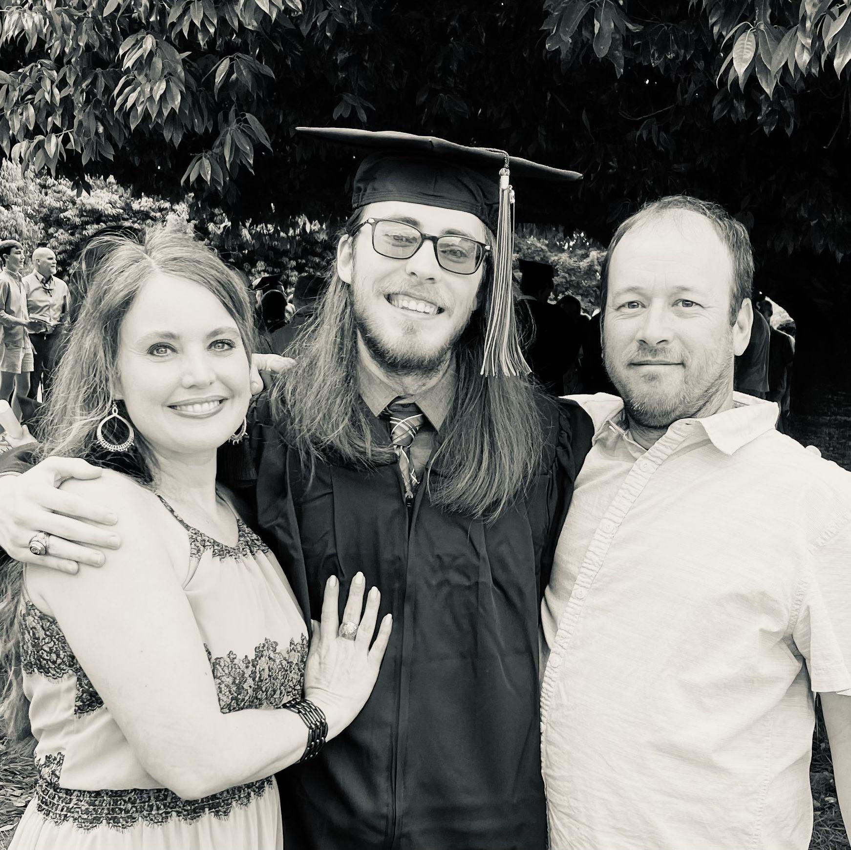 Nathanael with his parents at graduation