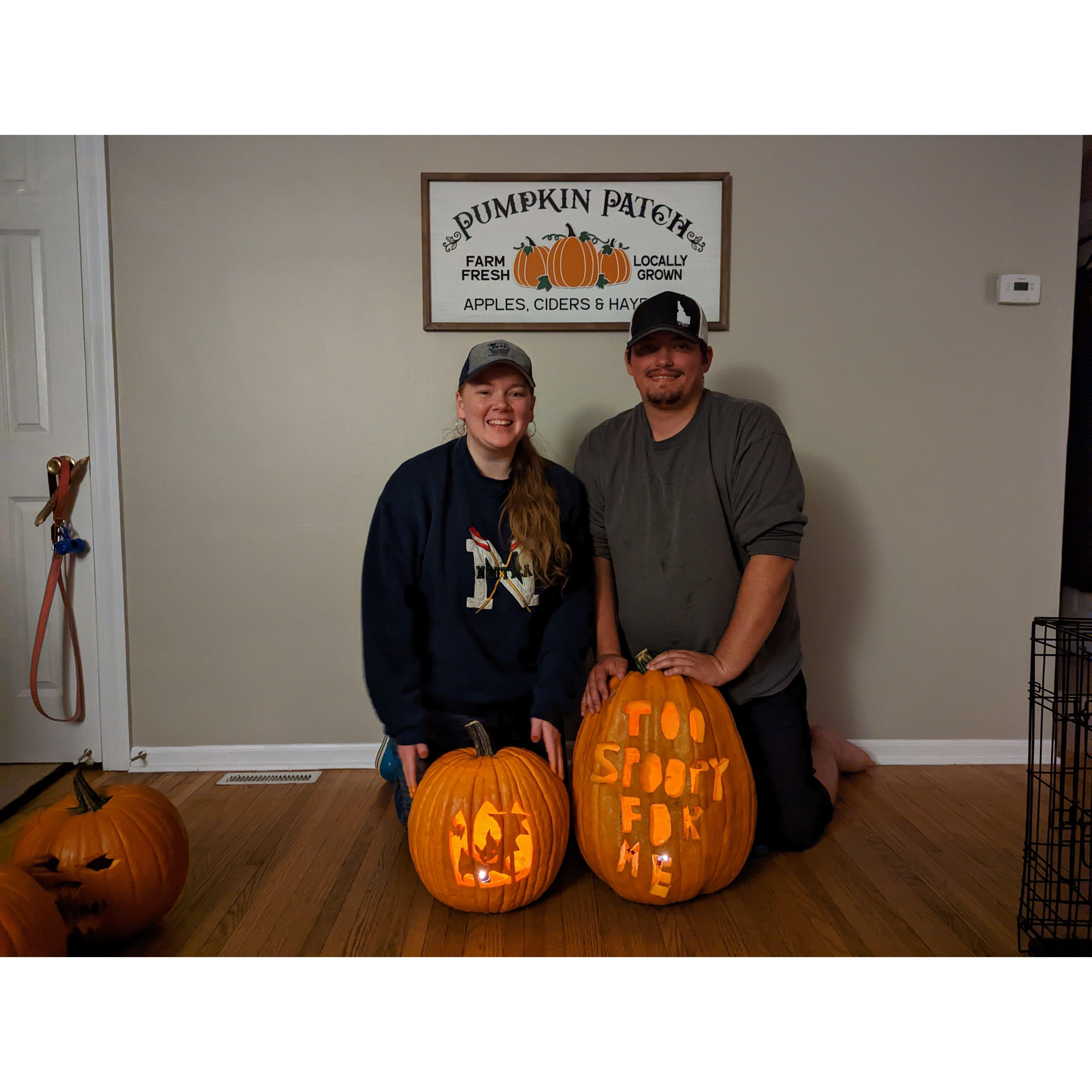 Tori and Tom with the pumpkins they carved in 2022.