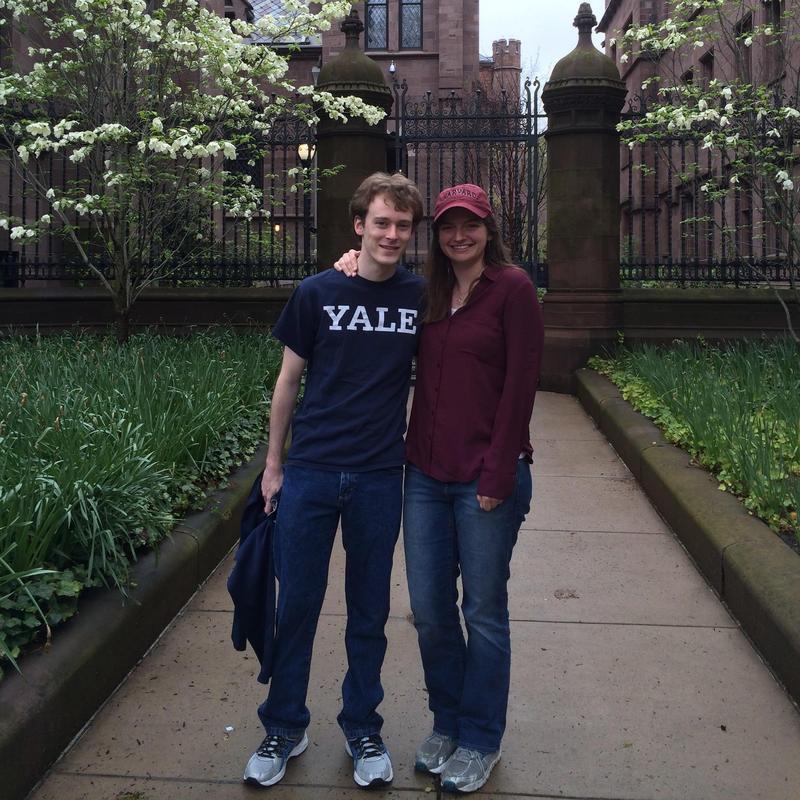 Kathleen bravely tries out her new Harvard-MIT gear on a trip to New Haven.