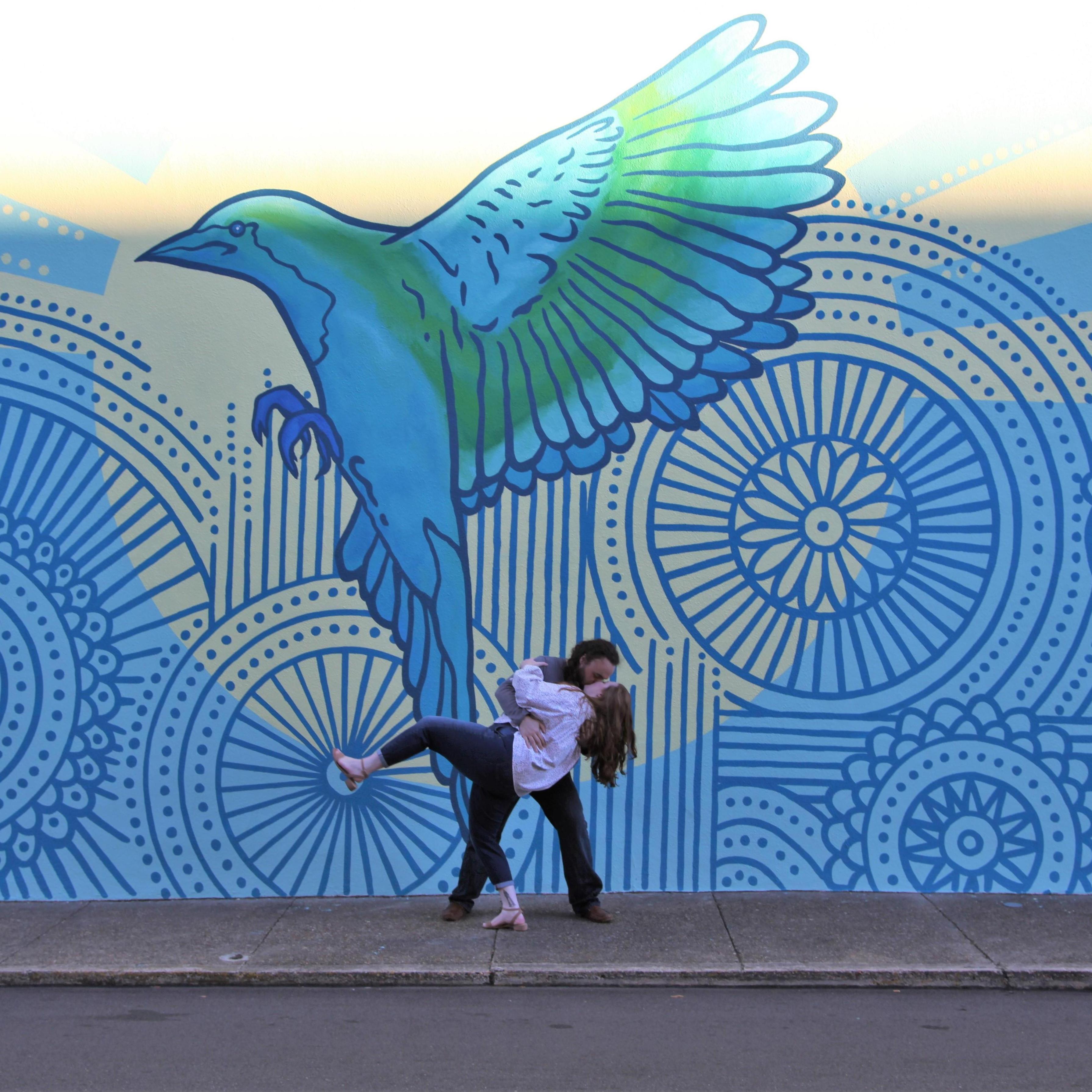 A silly swoosh by a mural outside our favorite wing place!