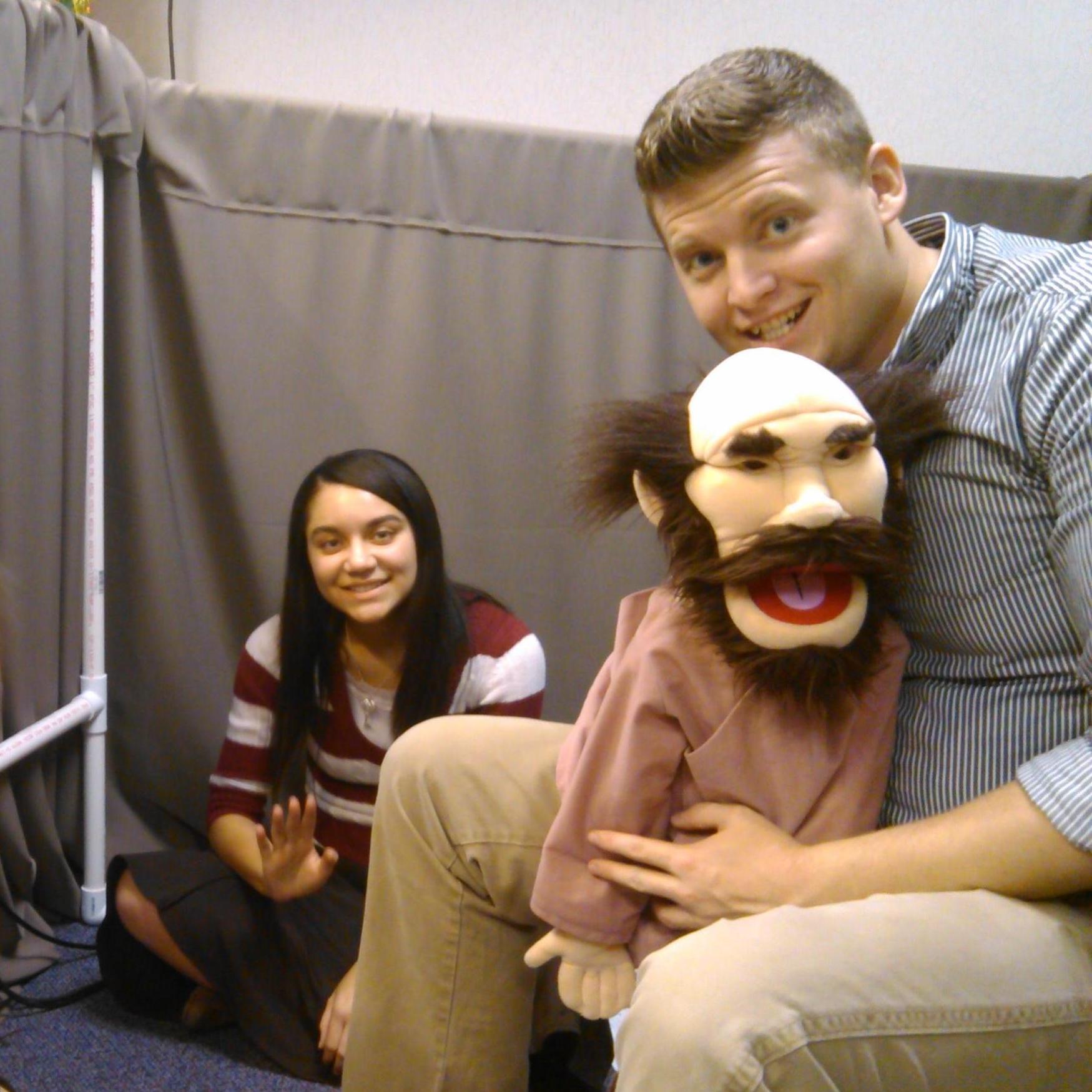 This is one of the first pictures I have of Taisa. Of course it's behind the puppet stage. (Zach)