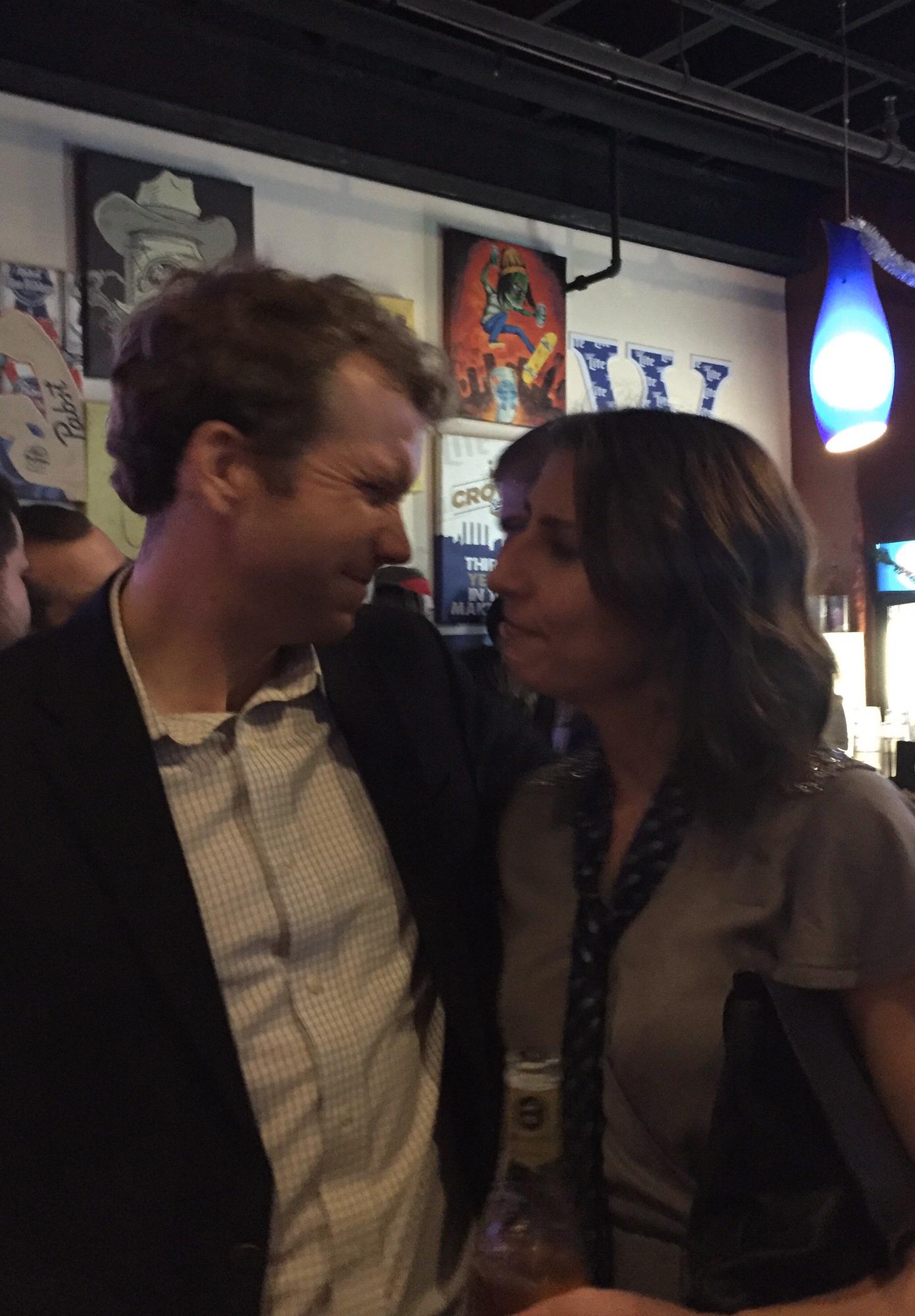 One of their many moments when Amanda downplays what she does, John then brags about Amanda, then they look at each other.